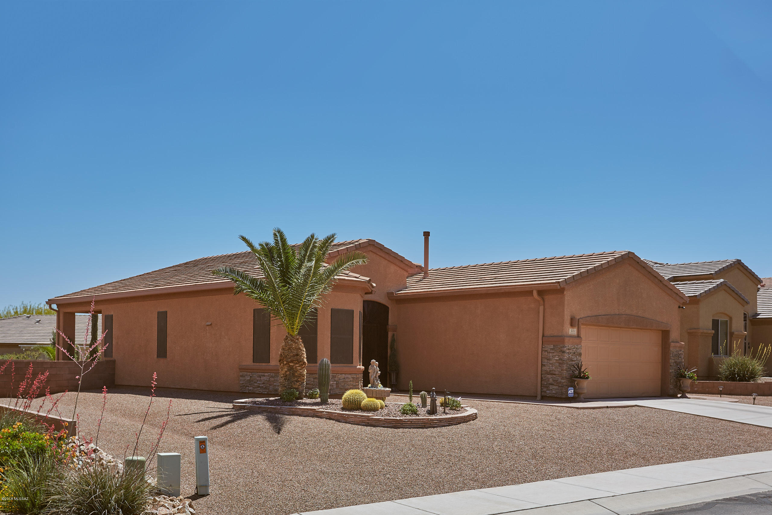 Immaculately taken care of home is now available in the 55+ community of Las Campanas in Green Valley w/Santa Rita mountain views. All décor work is that of a fine Italian trained artist including custom European ''cracked-linen'' tri-plaster walls (excellent for insulation) Hunter Douglas woven wood shades, designer paint, crown molding & artisan cabinetry finishes. Comfortable floor plan with plenty of natural light. Prochain tile & wood laminate are in living areas & beautiful natural stone tile in master bath. Landscaping in front and rear yard is very low care & wonderfully attractive including drip irrigation, extra thick layer of gravel, solar lights & pavered walkway, and large covered patio. Other features of this home are reverse osmosis system, Sears warranty on all appliances.