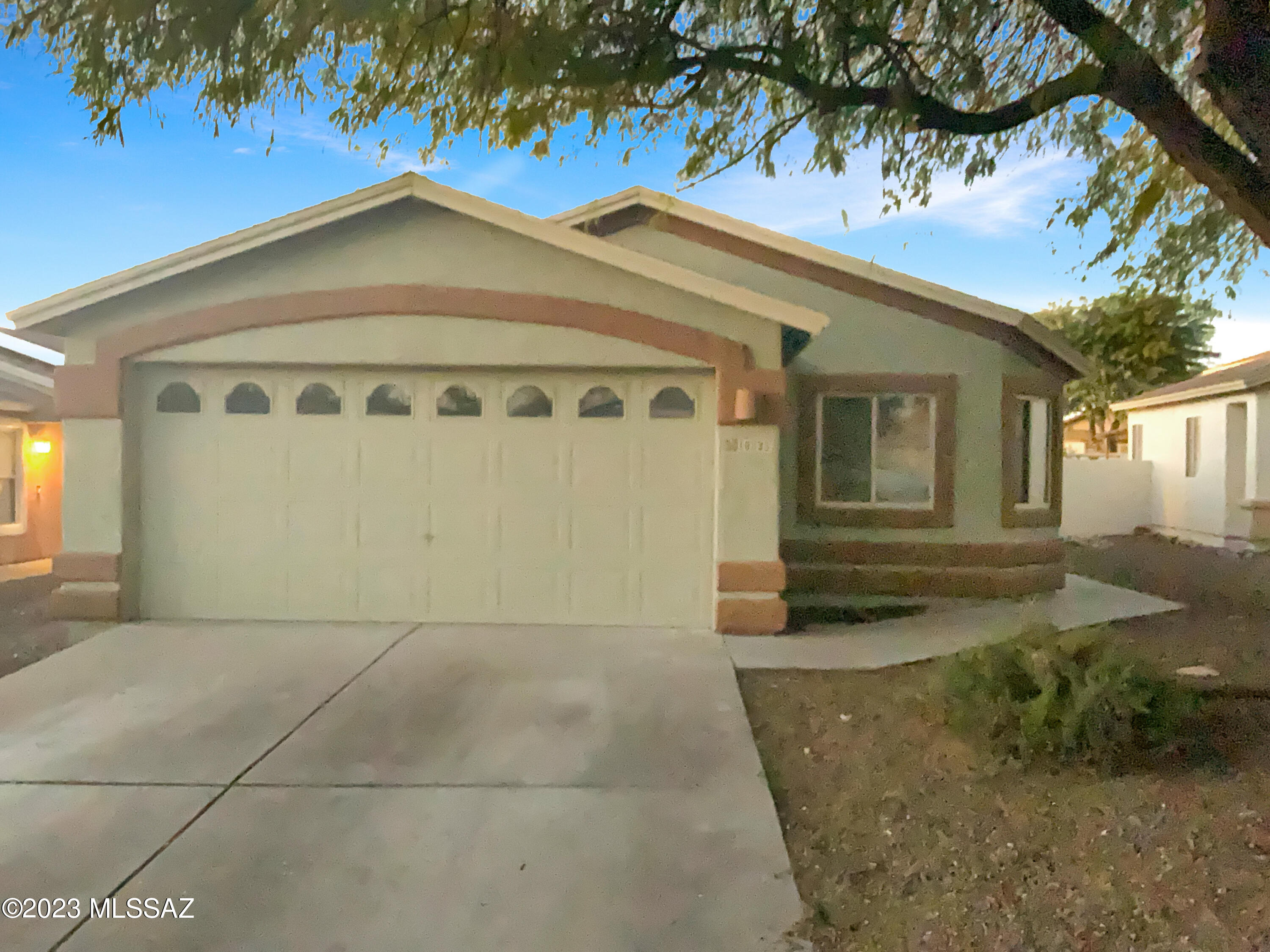 This updated Rita Ranch gem is ready for you! Fresh paint and new carpet in modern colors set the tone as you enter the open floor plan. The white kitchen features stainless steel appliances, abundant cabinets, and room for an island. The highlight? A HUGE yard with low-maintenance landscaping, one of the largest in the area. The primary bedroom boasts a fan, walk-in closet, soaking tub, dual sinks, and a great yard view. A hall bath serves the other bedrooms. Enjoy comfort, style, and space in this move in ready home!