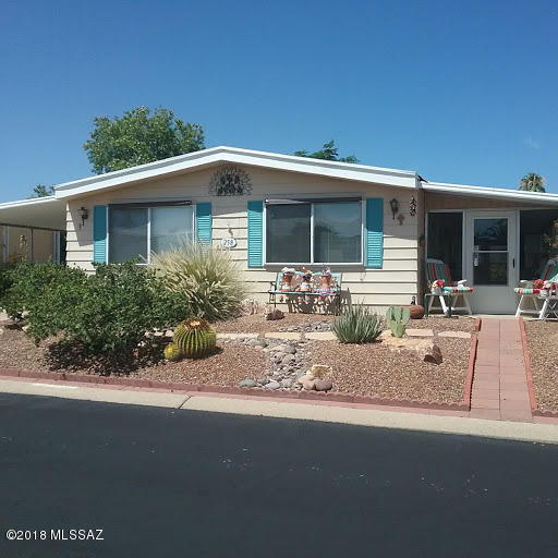 This home in very desirable Pueblo Estates has so much to offer.  Two bedrooms, two bath with large screened porch for the wonderful Arizona weather.  Vinyl plank flooring in living, dining , kitchen, hall and guest bath 2016. HVAC 2009, new gas main and meter in 2018.  New executive height toilets both baths, dual pane windows, newer appls, new security door,  Roof replaced July, 2017.  Huge storage shed on property.  You will enjoy the fenced area in back for relaxing and/or entertaining.  Nice size lot with mtn. views.  NO GVR, but available.  Pueblo Estates has much to offer, heated pool, hot tub, rec. hall and exercise room.  Lots of activities  all though the year. Please excuse boxes, seller is packing to move., Seller needs to remain in property for 2 weeks after closing date!!