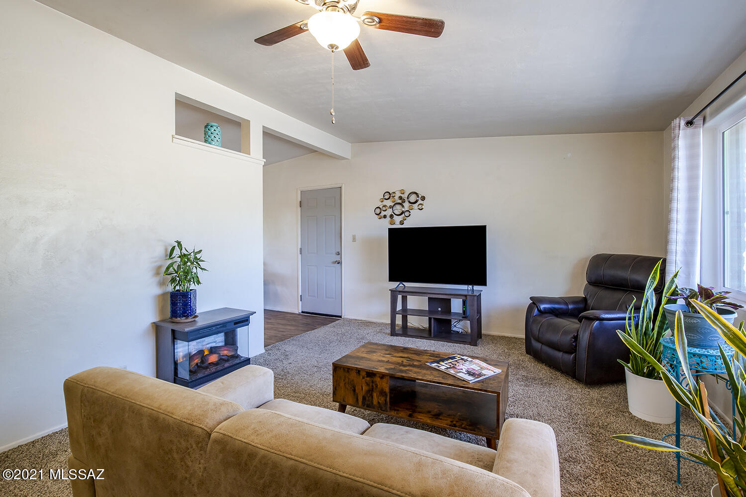 This lovely 2 bed/1 bath house is the perfect starter home or 1 person paradise. This property has been beautifully maintained inside and out with an updated kitchen with all stainless steel appliances, new windows, and xeriscaped yard with native plants for low maintenance and a low water bill. A true highlight of this property is its beautiful Arizona room, a covered patio with custom tile. 5 minutes from the freeway ensures quick access to all areas of town or a quick 7 minute drive to downtown Tucson where you will find amazing food and entertainment. Grab dinner at The Hub and take in a show at The Fox Theater, there are endless possibilities with the location of this home.