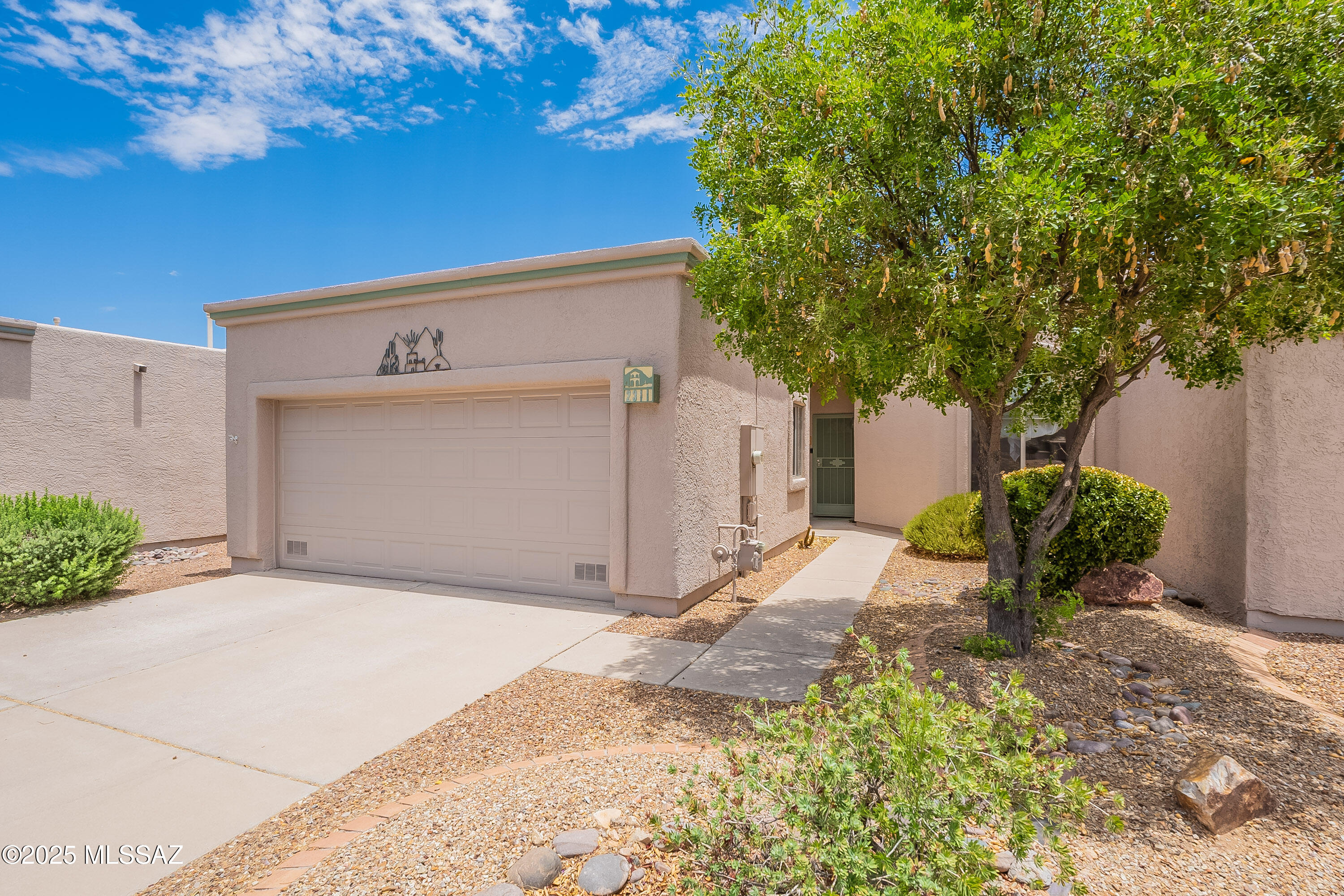 Bright, spacious, and beautifully located! This 2-bedroom + den, 1616 sq ft single-family home boasts soaring ceilings, abundant natural light, a cozy fireplace, and breathtaking panoramic mountain views. Nestled in a gated community right across from the clubhouse and pool, it offers easy access to social and recreational perks. Enjoy elevated outdoor living with a covered patio and stunning views. Deeded with GVR membership, you'll have access to 14 recreation centers filled with clubs and activities designed for the active retiree. The primary suite features a private ensuite for added comfort and privacy. Come experience a lifestyle of ease, beauty, and vibrant community living!