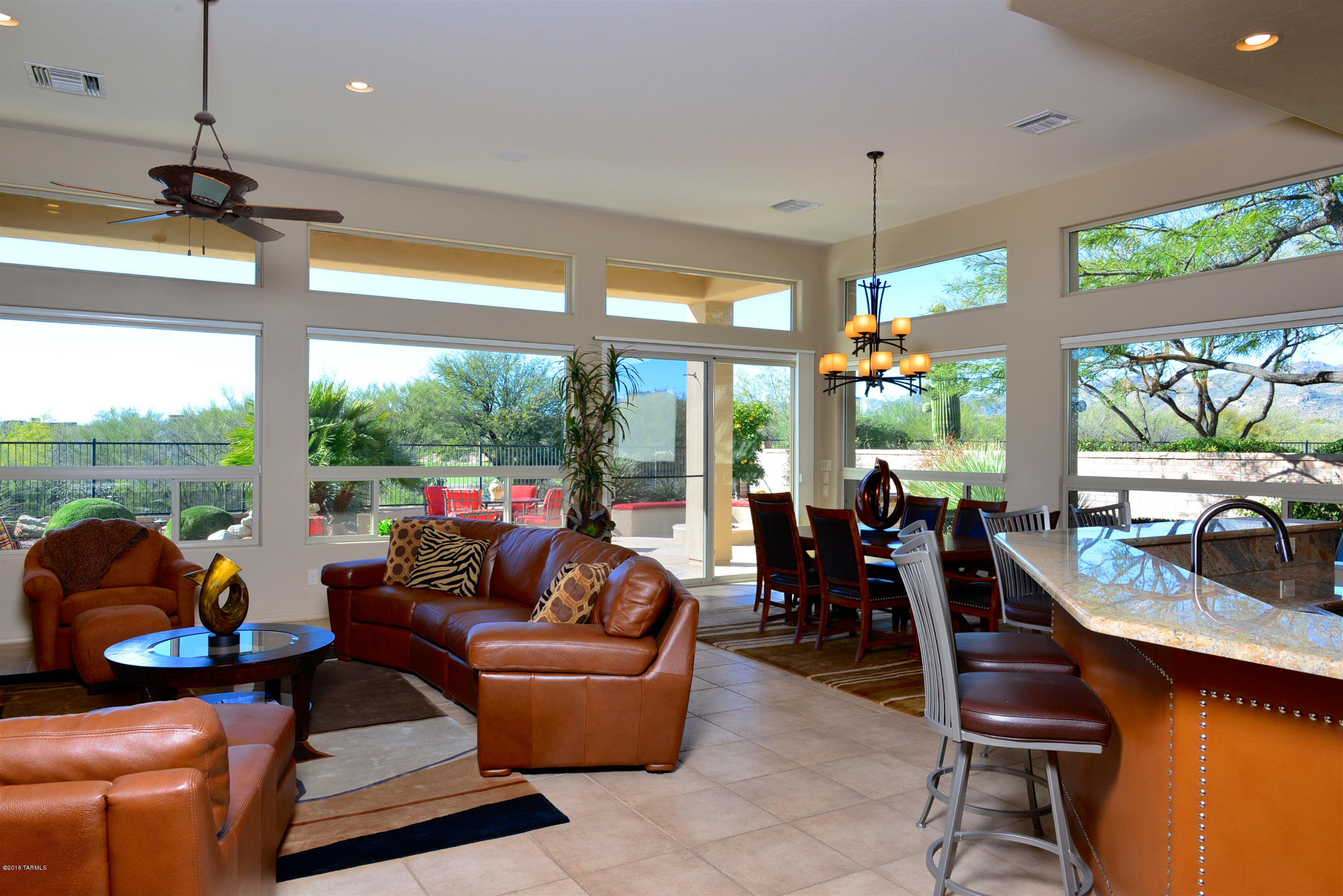 Delightful & updated 2,549 SF masonry home on 2nd fairway of Vistoso Golf Club with serene golf course, Tortolita Mtns and sunset views in Fairfield Rancho Vistoso, Oro Valley's luxury 68-home gated golf community. Light and bright w/high ceilings & windows and all tile floors (no carpeting), this great room style 2BD, Den & 3BA residence in one of Rancho Vistoso's most desirable communities is the perfect AZ golf retreat! Fabulous kitchen w/granite, large bar, contrasting island, SS appliances & gas cooktop. Spacious Master w/door to patio, Guest Suite, Powder Rm, and Den w/built-ins. Enjoy laid-back AZ lifestyle and sunsets while relaxing on your west-facing patio w/BBQ, pool w/rock waterfall & Firepit seating. Community rec area w/heated pool/spa. Available Turnkey at $587,500.
