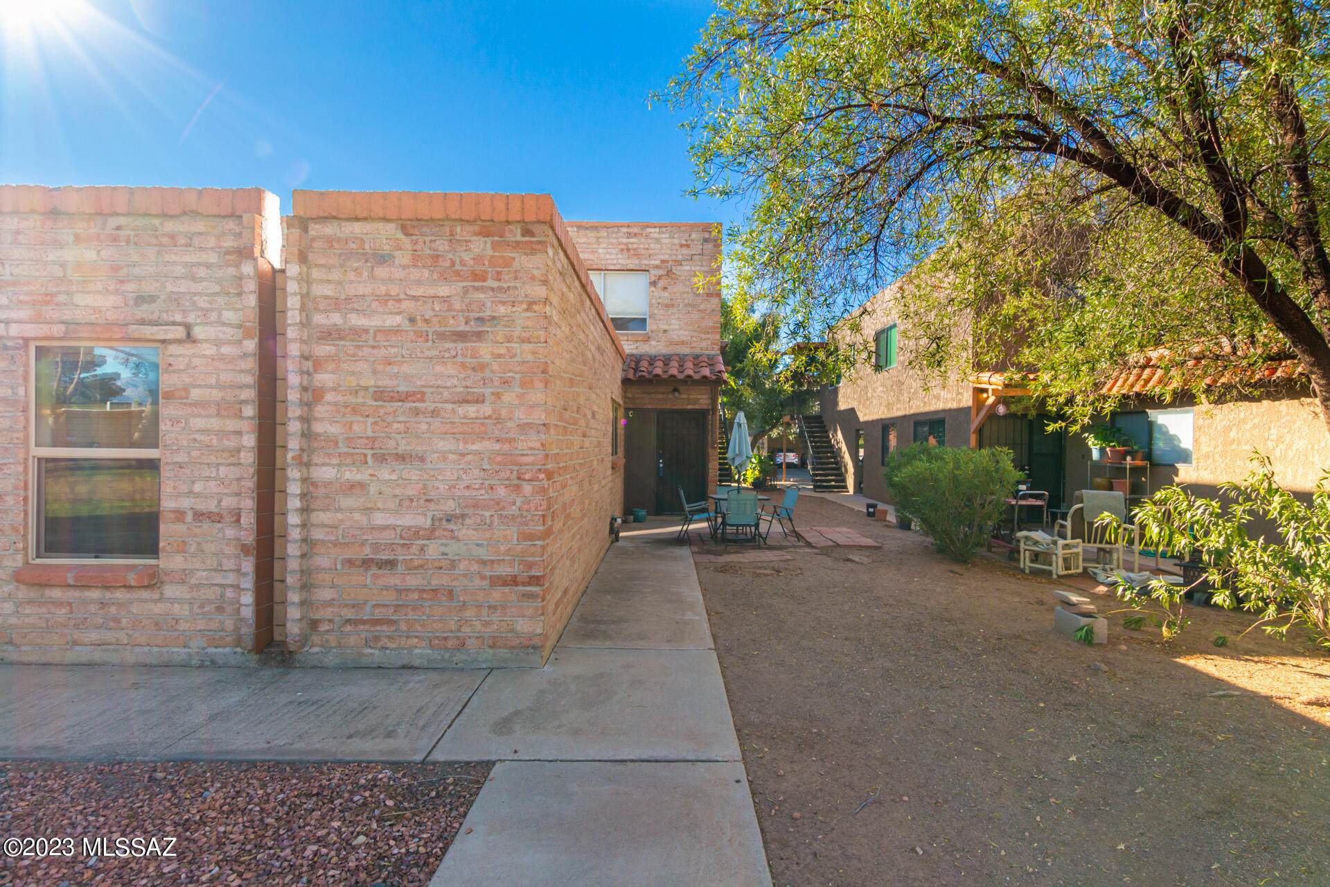 Great opportunity for first time home buyer or investor. Priced for quick sale. This unit is 2 bedrooms, 1 bath, roomy living area including a dining area and kitchen with lots of cabinets, pantry, built in microwave, newer appliances, refrigerator included. The unit is close to 1  of 2 community pools and boasts mountain views. Bedrooms are comfortable size, 1 with deep walk-in closet. Lots of storage including storage space in the carport area. Laundry facilities for each 4-plex and 1 car covered parking.