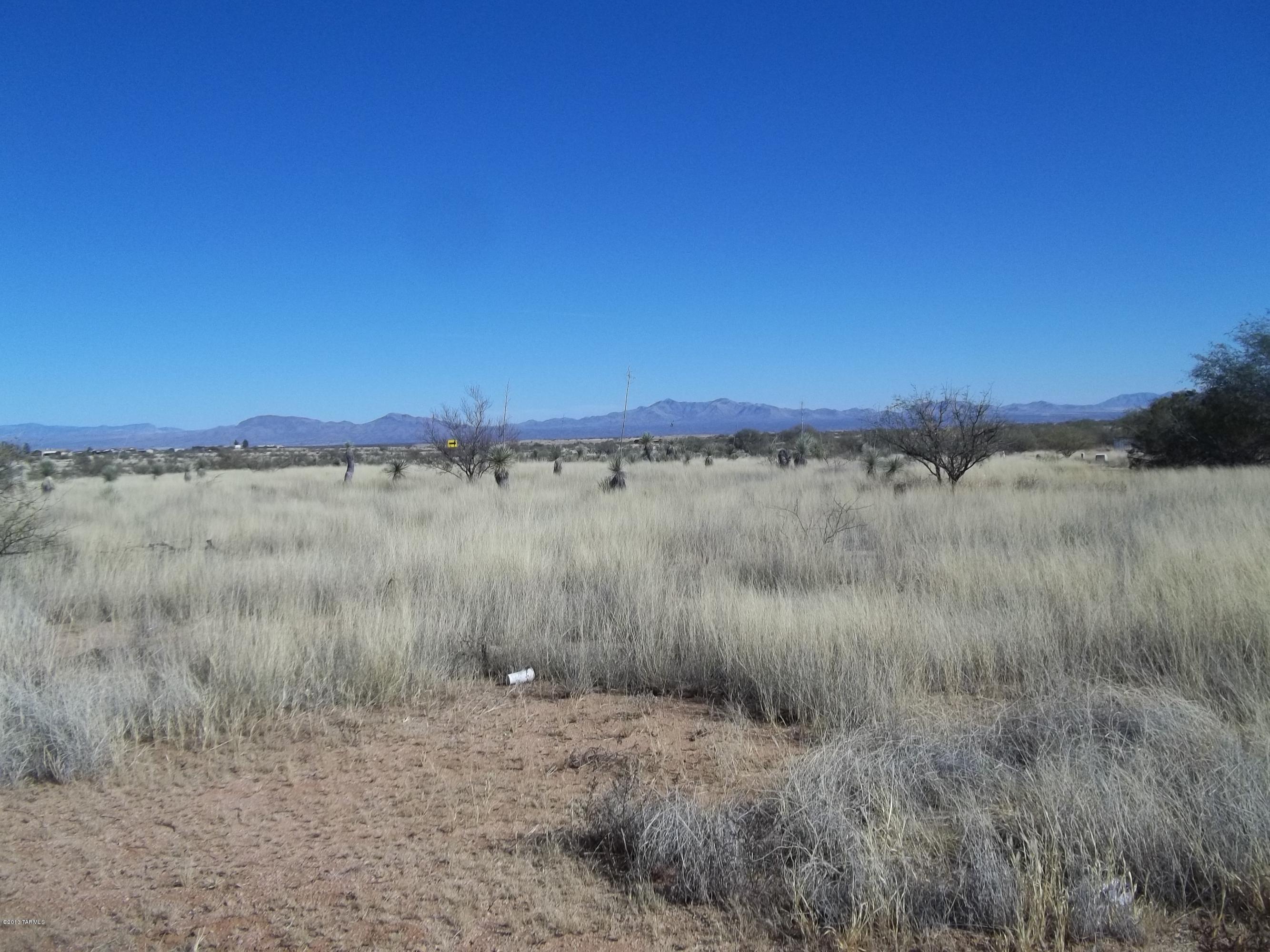 Excellent building site! Two adjoining  lots sold together. Utilities nearby. Views in ALL directions. Hard surfaced road with easy access to Tucson, Benson, Sierra Vista, etc.