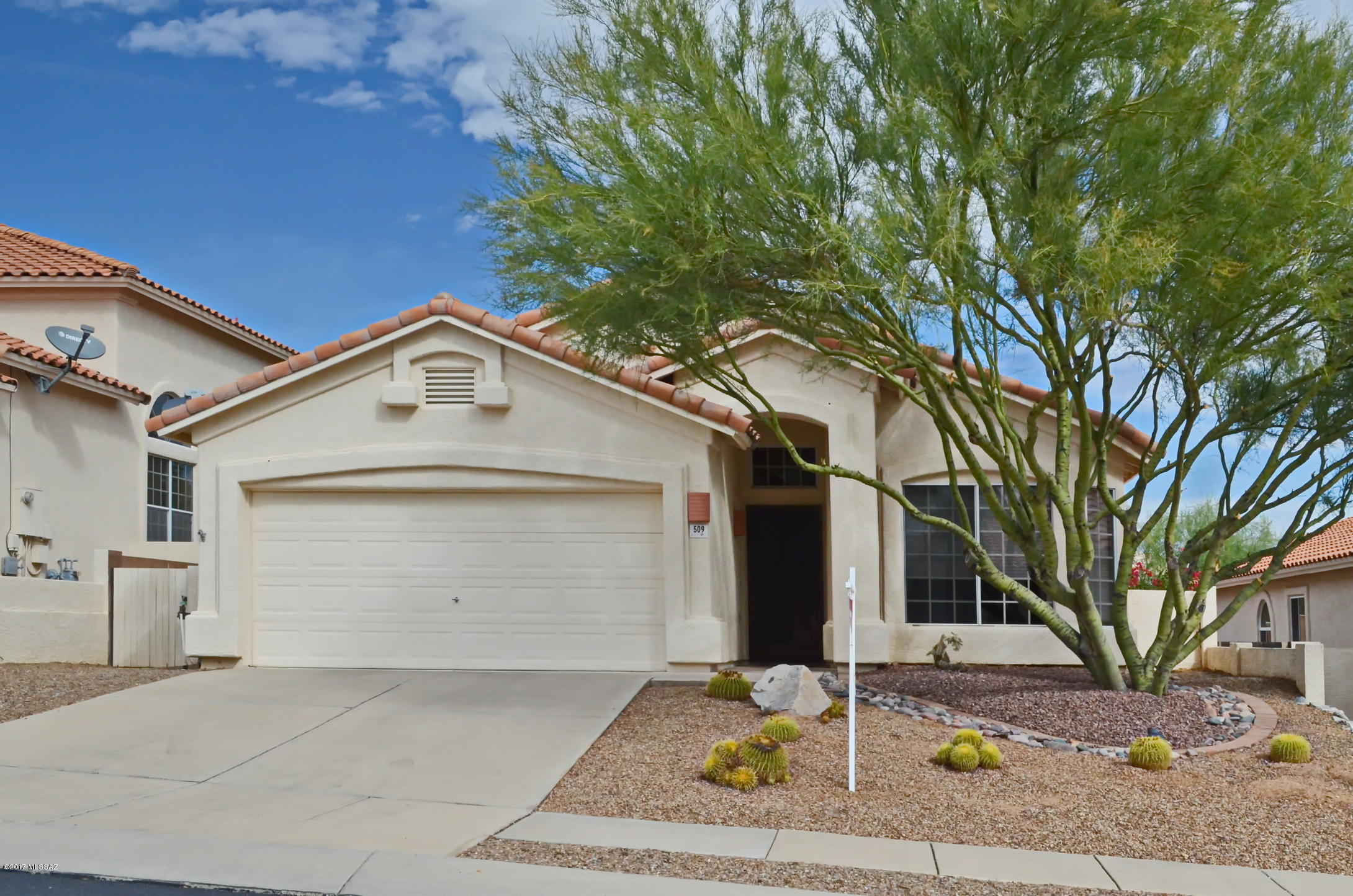 Nicely updated and lovingly cared for home in Rancho Vistoso, Oro Valley. Beautiful cherry wood flooring in living, dining and family rooms, over-sized ceramic tile in the entry, kitchen and bathrooms, fabulous over-sized multi-head walk-in shower in the master bathroom. Updated kitchen with stainless steel appliances and granite counter tops. Newer HVAC unit. East facing rear yard with nice mountain views. Granite countertops in both bathrooms with additional upgraded fixtures. Finished floor in the garage. Terrific home shows wonderfully.