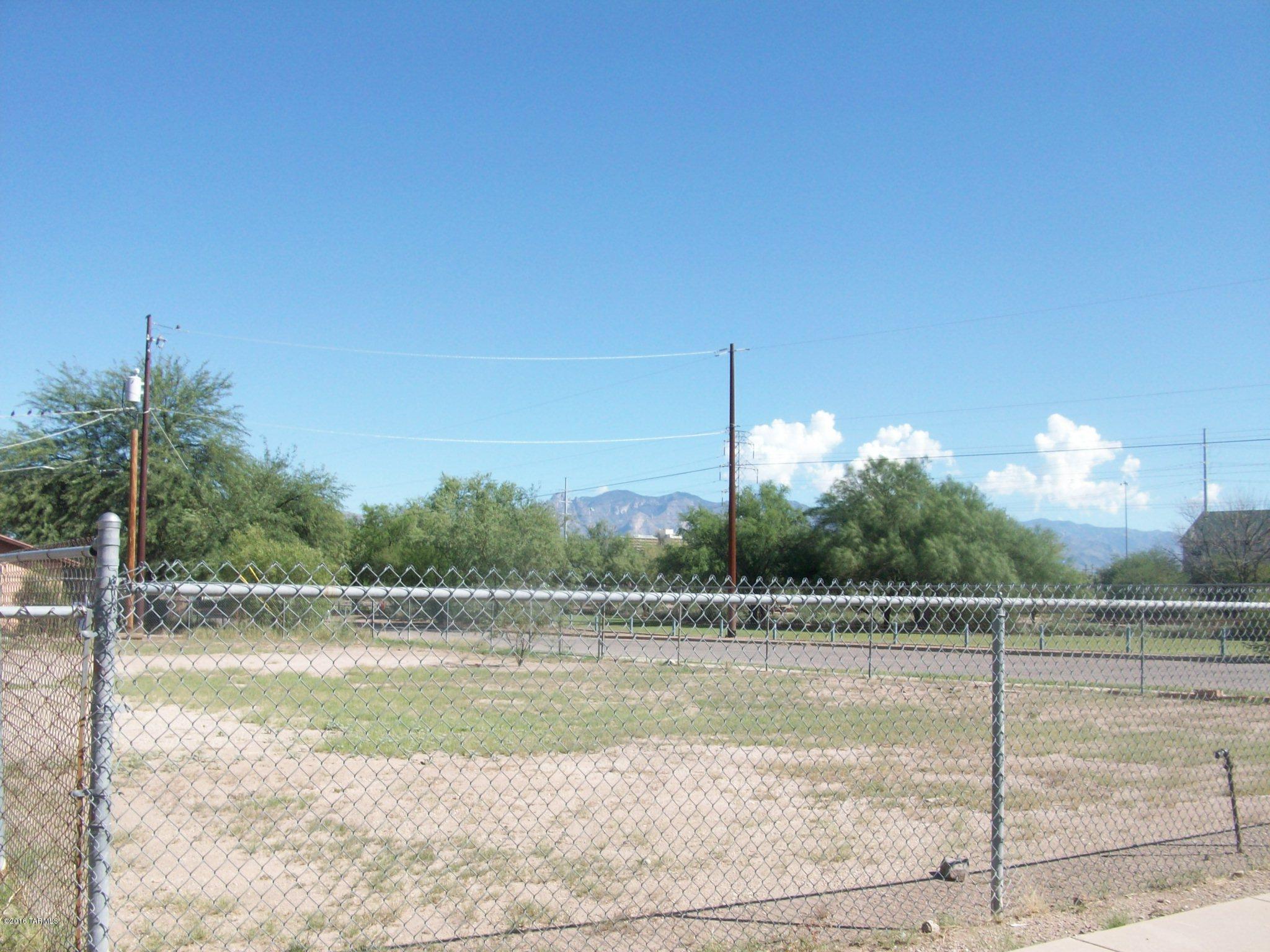 Small infill lot in Riverside Park area - across the street from the park - corner lot - chain link fence 2.5 sides - utilities at street.  Great location for small (maybe even Tiny) house.