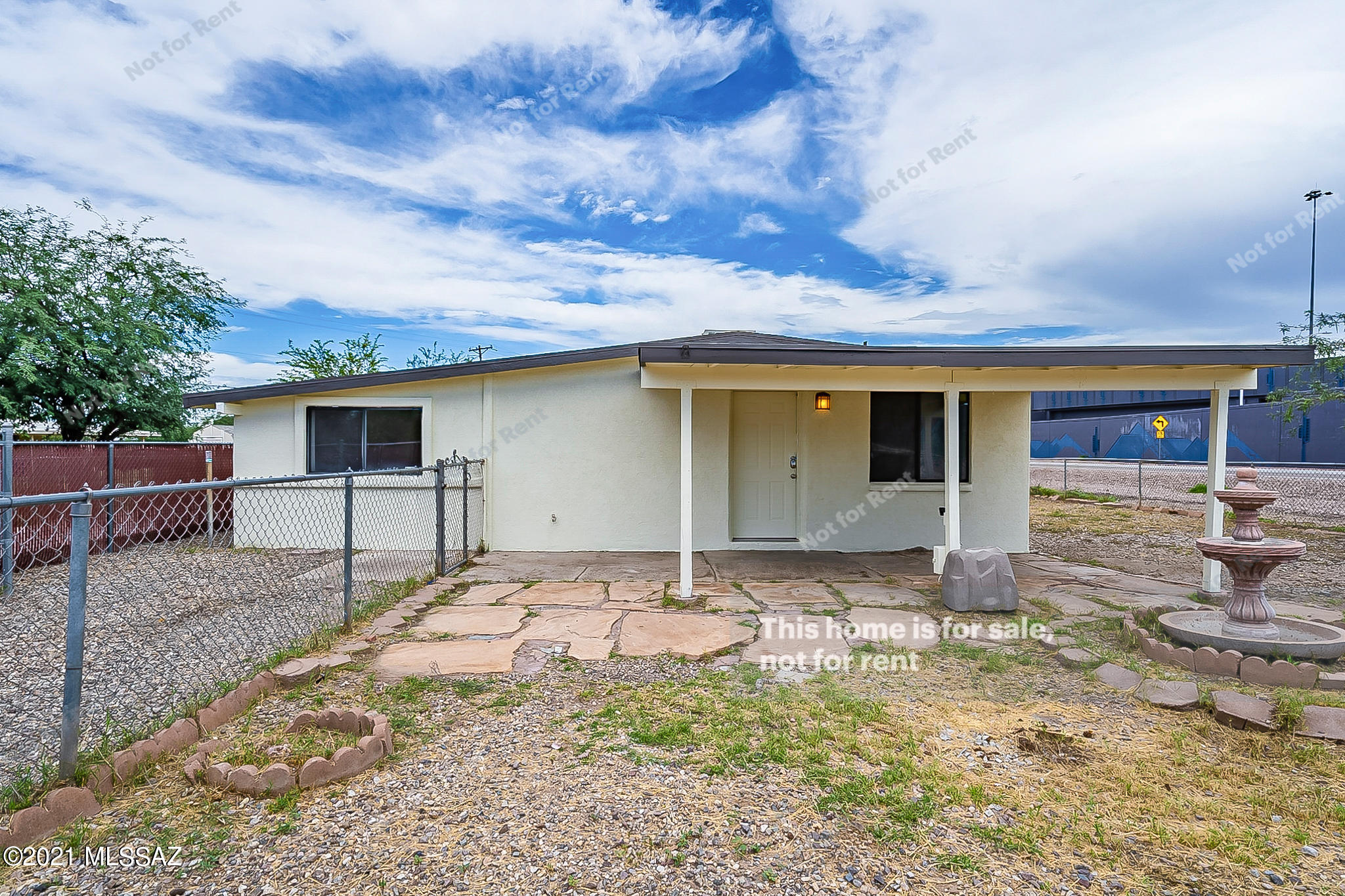 This Tucson home has one story. This home has been virtually staged to illustrate its potential.