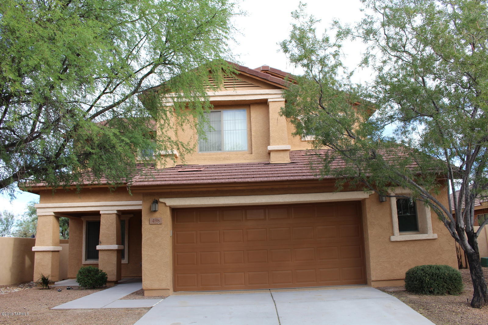 Prime GATED Entrada Bonita in  Rancho Sahuarita! Exclusive gate entrance to Anza Trail School, walk to Sahuarita Lake, jogging trails, community pool, parks & close 2 shopping. Step in and your eye goes to the soaring ceilings and light filling the open and airy floor plan.  The upstairs Grand Owner Suite boasts a HUGE walk in closet and private balcony with views of the Mountains! NO rear neighbors. Downstairs Den/Office with walk-in closet could be a 5th bedroom with addition of doors. Ceramic tile in the common areas & carpet in bedrooms and den. Upgraded kitchen, lots of cabinet space,island, stainless steel appliances. 2.5 car garage with newly painted floor.Spacious back patio with finished private yard. Wired for internet and Cox cable. All new paint.