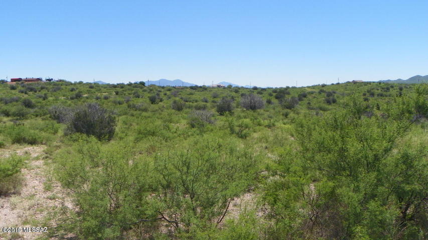Residential lot on paved road, about half way between Rio Rico Drive and Ruby Rd. on the East Side of Rio Rico.   Electric is at the street and water probably is too but that should be verified with the water co.