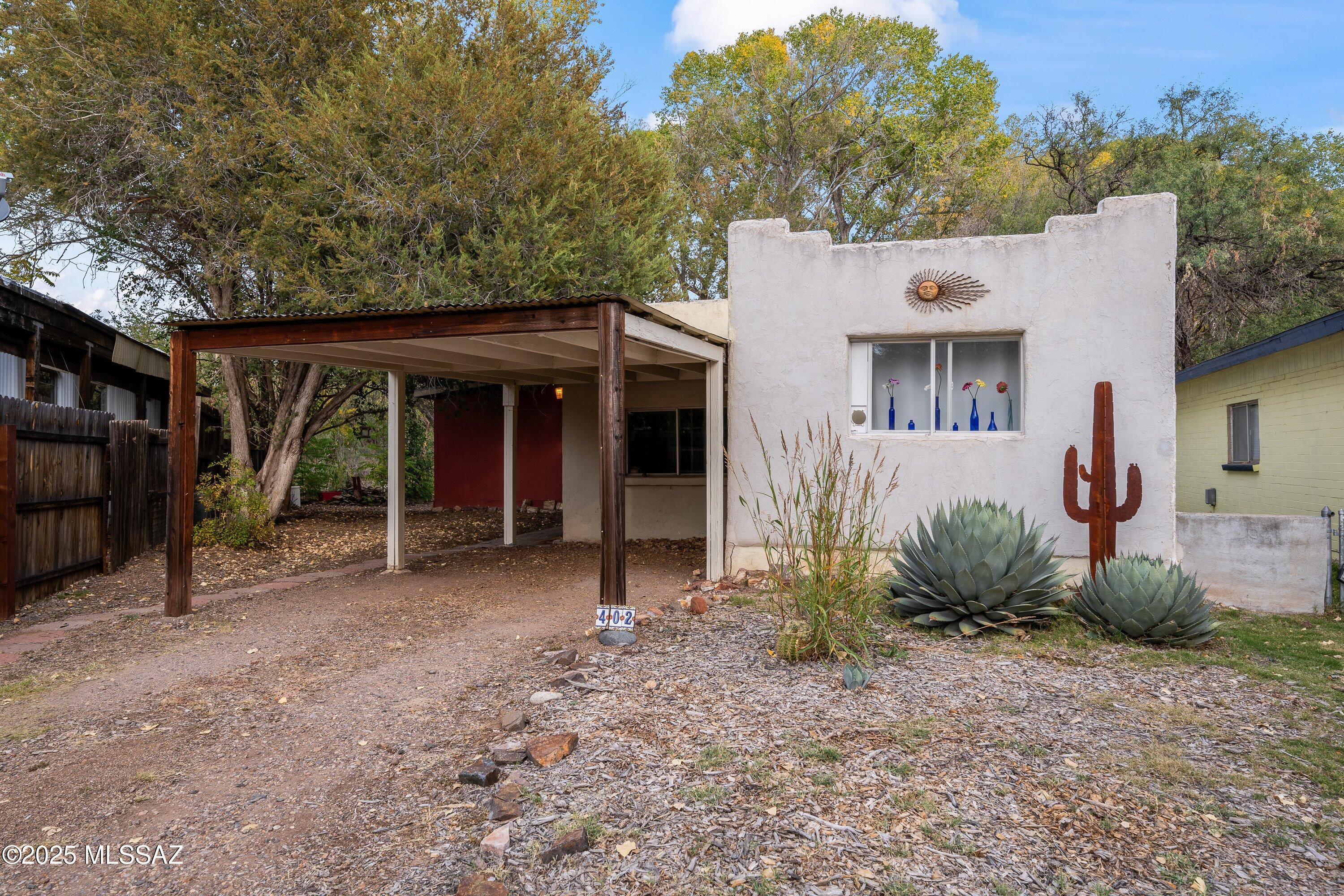 This charming 2-bed, 1.5-bath home sits along Sonoita Creek and offers a perfect blend of nature, comfort, and convenience.  Located in a peaceful neighborhood and just a short walk from town, it provides easy access to everything Patagonia offers. The brick Arizona room adds great extra living space and includes a convenient half bath. A versatile bonus room is ideal for guests, hobbies, or a home office. Outside, the ramada is the prefect spot to enjoy morning coffee while watching wildlife. Mature trees and nature create a truly relaxing atmosphere.  Whether you're seeking a weekend getaway or a full-time residence, this warm and welcoming retreat offers charm, character, and a truly special setting that invites you to slow down and savor the beauty of the area every single day.
