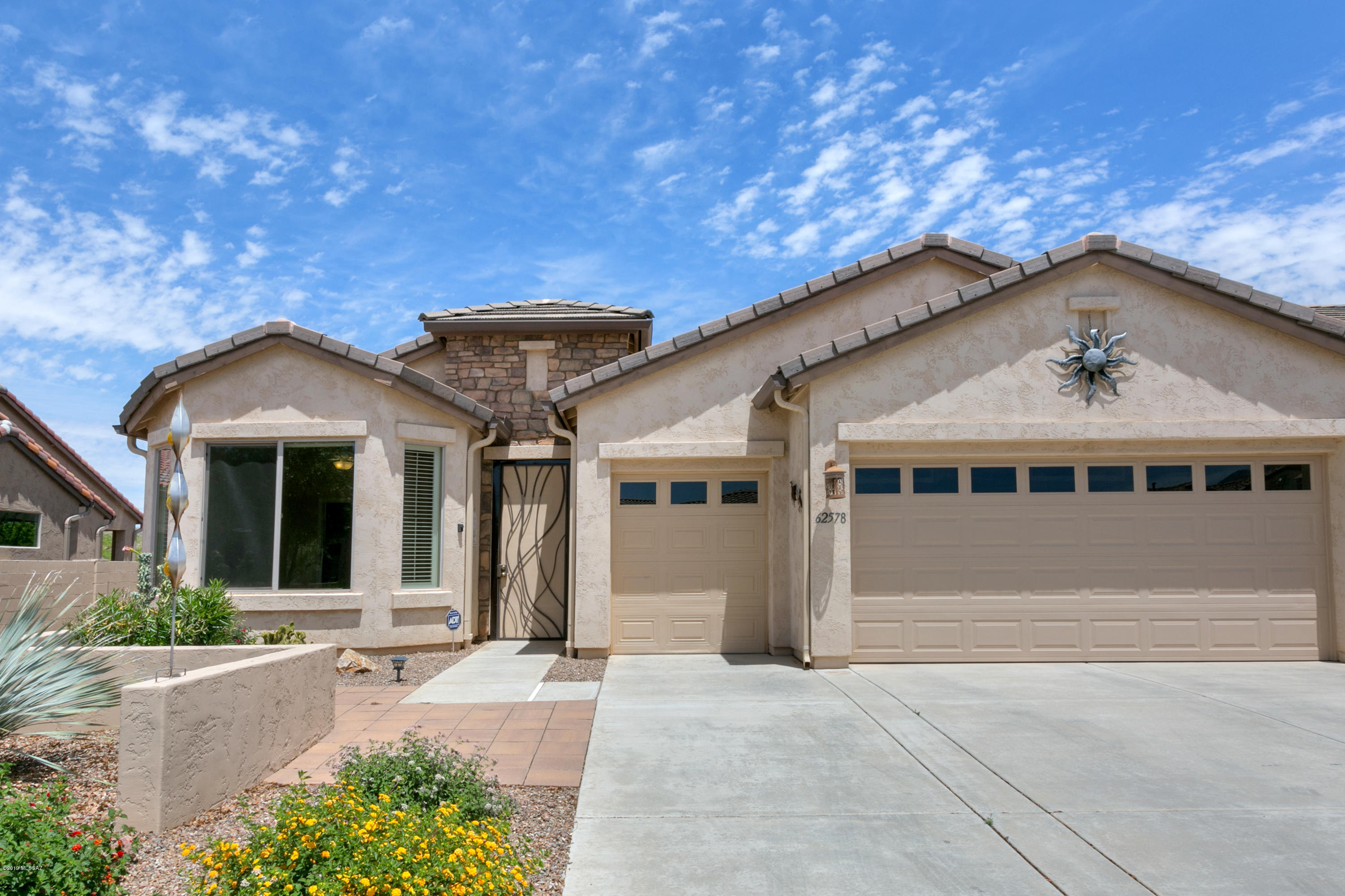 Fresh Bright Dolce Built in 2011 with Backyard Overlooking Large Open Green Space with Mountain Views. Guest Bedroom Suite with Private Bath, Den/Office & 2.5 Car Garage With Overhead Storage Racks & Work Shop Space. Most Rooms Freshly Painted. Great Room is Adorned by Corner Gas Fireplace. Open Concept Living with Kitchen Offering Spacious Slab Granite Island & Stainless Appliances. Dining Area Complemented by Upgraded Bay Window. Window Treatments are a Combination of Plantation Shutters & Hunter Douglas Honeycomb Blinds. Bathrooms have Large Tiled Showers with Glass Doors & Quartz Counters. Out Back There is a Large Covered Patio to Enjoy the Serene Open Space. Unit 49 is An Active Neighborhood with Planned Social Events.  SaddleBrooke Offers 100's of Clubs
For SaddleBrooke Resident