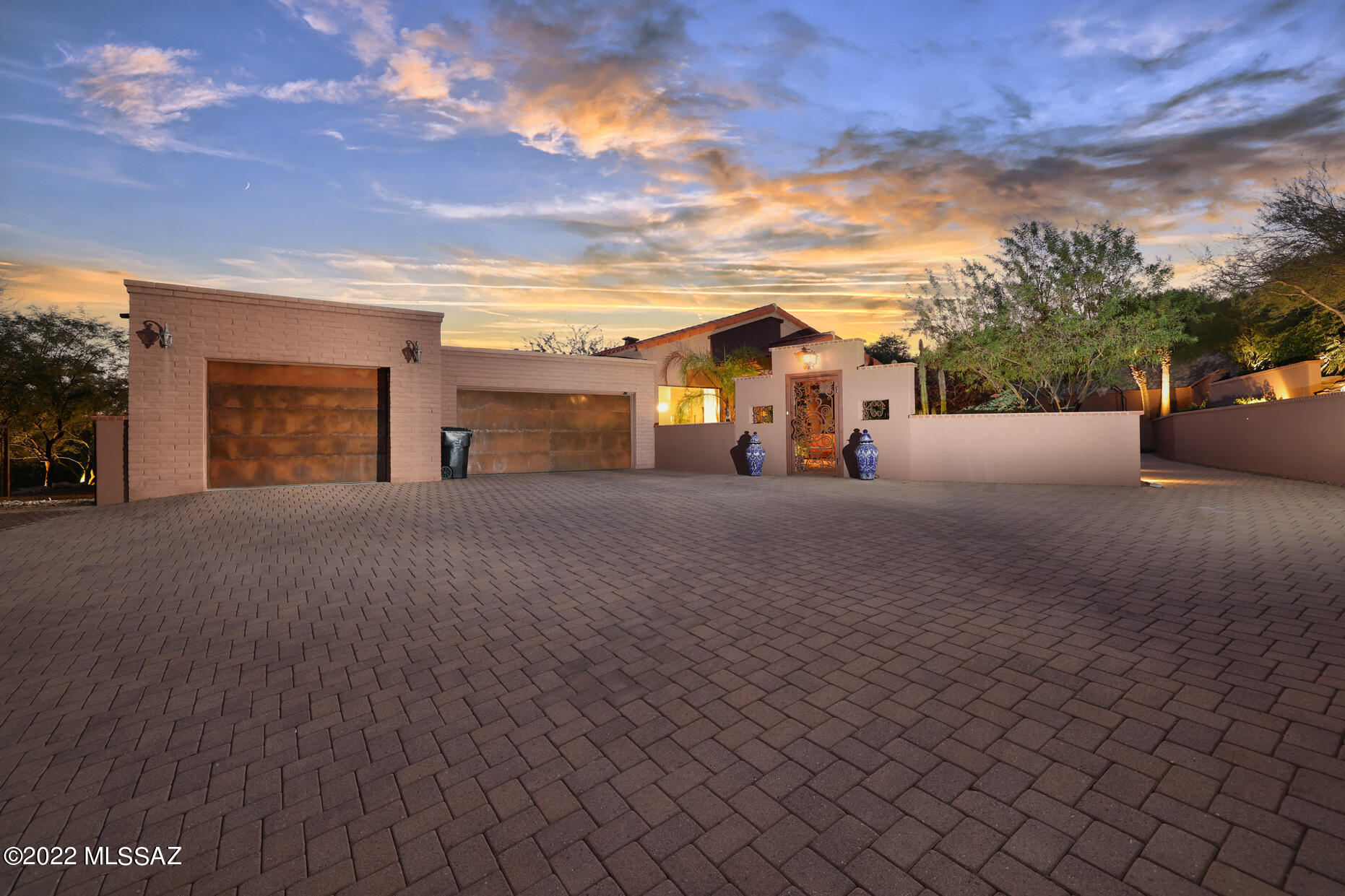 Views, Views, Views, amazing City lights and Mountain views in Cimarron Foothills Estates.  This beautiful home is one level, 4 bdrms, & 3 full baths plus an office and 3 car garage.  Paved driveway leads up to beautiful landscaped courtyard with custom gate. Great room has soaring high ceilings, 16 x 16 travertine tiles.  Kitchen has leathered marble counter top & back splash, & SS appliances. TWO MASTER SUITES, split floor plan. Main has his and hers walk-in closets, 2 vanities, jacuzzi tub. Outdoor living with 180-degree views, built in BBQ & Fireplace with Salt Water pool and spa. Perfect for entertaining! School district 16.  BONUS AREA: 18 x34 with high ceilings could be workout studio, hobby room or 4th garage, complete with mini split and large storage closet.