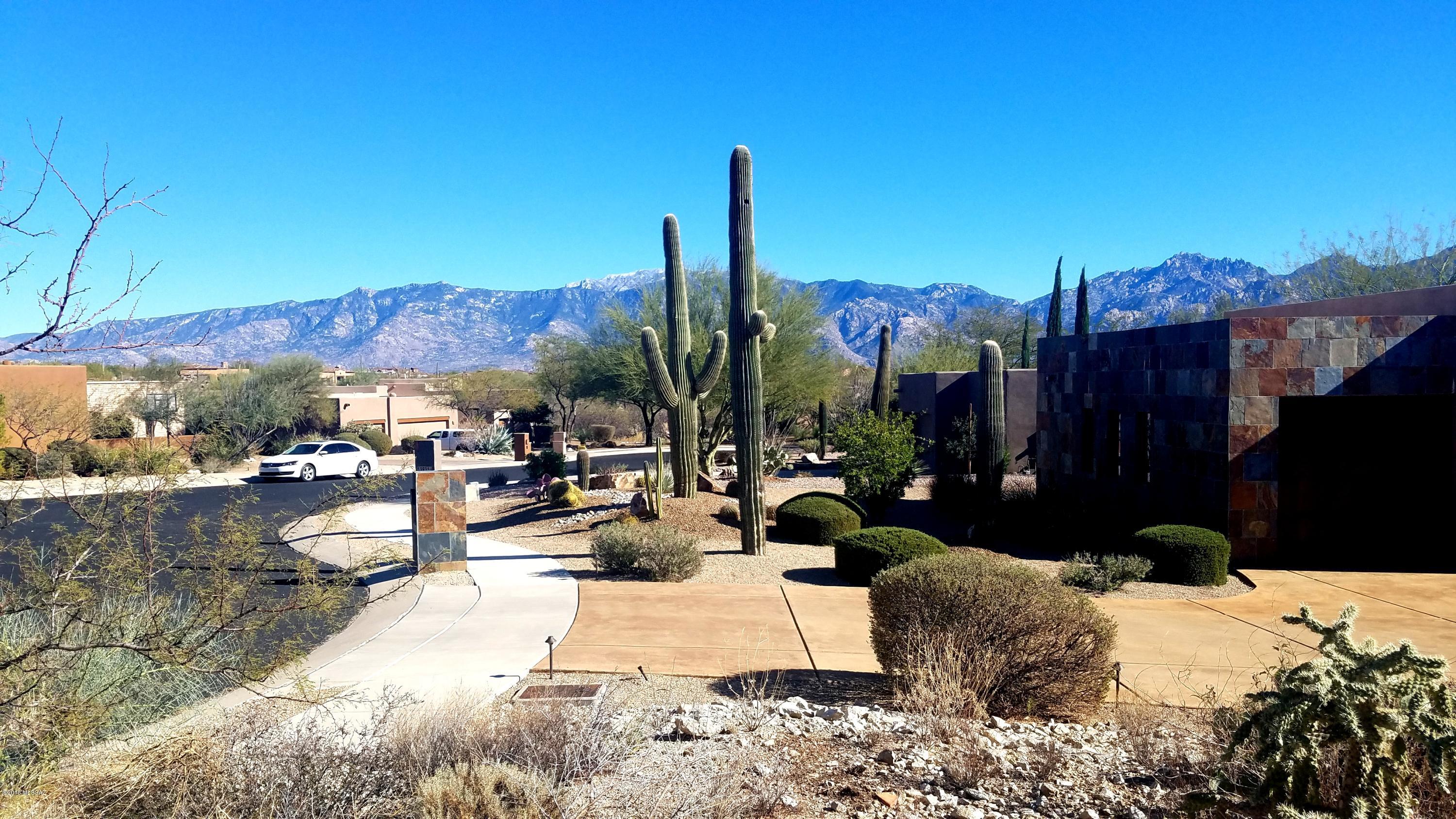 Quiet cul-de-sac lot in Rancho Vistoso's  ''VISTOSO HIGHLANDS,'' an electronically gated subdivision. Easy build lot with an east-west exposure. All neighboring lots have been built out so your mountain views are protected. This is nicer than you expect.