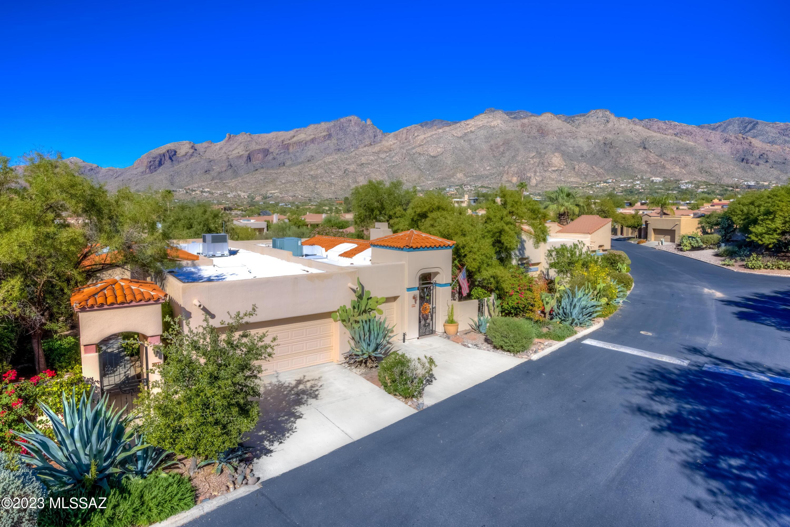 Step into this turnkey beauty! Nestled in a gated community, this fully renovated home is a blend of style and convenience. Sunlit with five skylights, the living room boasts a vaulted ceiling, wood-burning fireplace, and access to a covered patio with mountain views. The kitchen dazzles with Samsung stainless steel appliances, an induction range, and modern soft-close cabinets. Both baths showcase contemporary updates. The primary bedroom, with patio access, offers a skylight and three closets. Enjoy a newer roof (approx. 2 years old) and a serene backyard backing onto an arroyo. So, no neighbors behind! The sparkling community
pool is only two doors away. All appliances included, including the convection/air fry oven, making this an ideal, move-in-ready retreat!