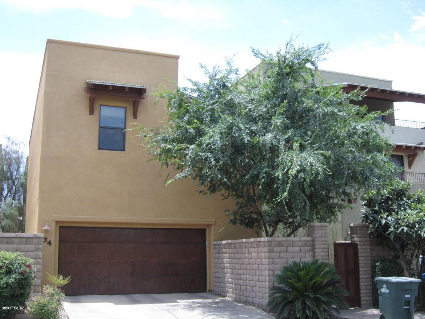Stunning barrio style 4 bedrooms, 4 full baths home in a gated community. Private courtyard & patio with beautiful mountain views. Open gourmet kitchen with granite countertops, beautiful cabinets and breakfast bar. High ceilings, fans, Decora switches, custom wood blinds and designer paint throughout. Security pre-wired, upgraded granite, carpet and appliances. Elegant master bath with 2 sinks, garden tub plus walk-in shower. Upstairs 4th bedroom has private entrance with full bath. Community playground, picnic area, pool, spa, dog park with private gate to the river walk. One block to Tucson Mall, Best Buy, Sam’s Club, Wall-Mart and restaurants.