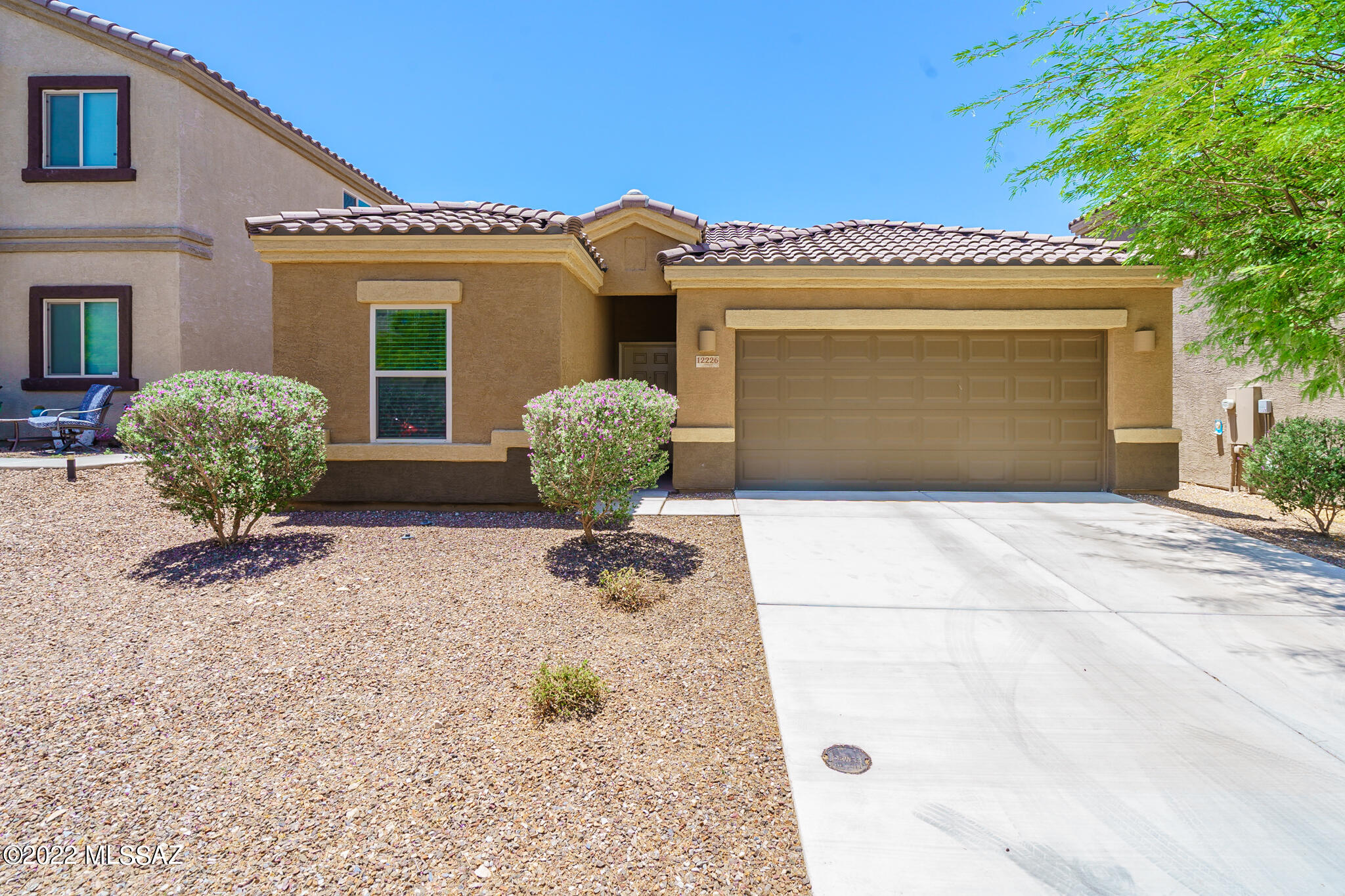 Looking for that perfect move-in-ready desert oasis, then look no further.  Built just a few years ago, this three bedroom and two bath home features stylish plank tile flooring in the main areas and custom two-tone paint throughout.  The open concept kitchen features a large island, granite counters, stainless-steel appliances and a large pantry.  The spacious main bedroom suite offers dual sink vanity, walk-in shower and closet.  Two additional guest rooms compliment the rest of the home.  Step out onto the private back patio to soak in some sun or take a dip in the above ground pool and spa.  No rear neighbors.