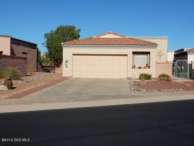 Fabulous, fully furnished Jasmine model overlooking San Ignacio Golf Course with gorgeous golf & partial mountain views in popular active 55+ area. Nicely landscaped gated entry courtyard entry with viewing deck. Light & bright home with split bedroom plan & green views from almost every window. Kitchen/family room opens to a great screened back patio perfect for entertaining & enjoying the beautiful views. Walled yard with extended flagstone & bricked patio with Tubac Yucca fountain, planters & tangerine tree. Owner's suite with walk-in & additional closet. Laundry room with built-in desk & upper cabinets. Garage has built-in cabinets & workbench with bump out. Water softener and reverse osmosis. Roof and termite warranty. Newer exterior paint. Immaculate and move-in ready. Must see!