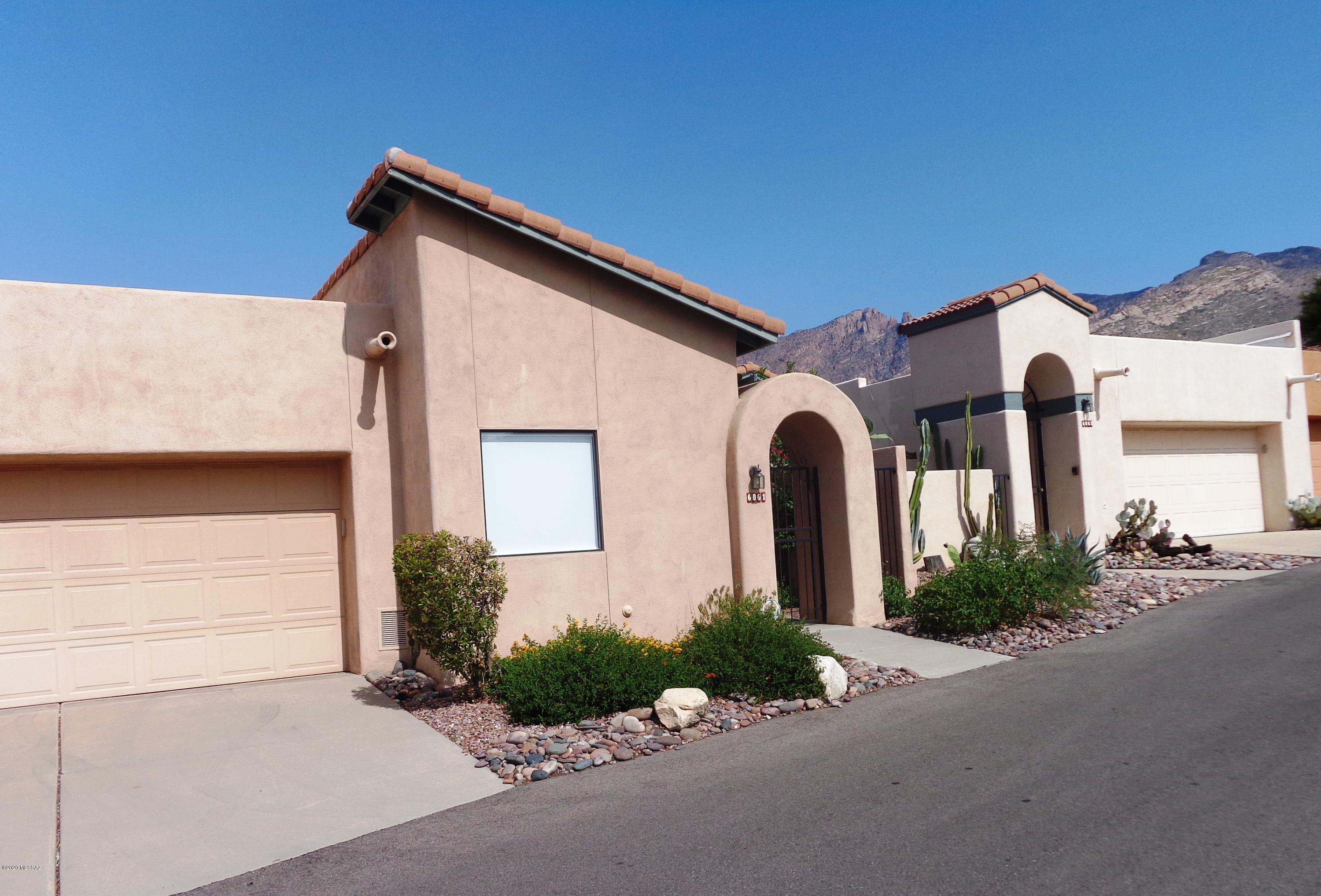 Tucked away in the gated community of Kachina Hills this light and bright townhome is what you've been waiting for!  Located in the Catalina Foothills, this spacious townhome has been meticulously maintained by the original owner.  Large, eat-in kitchen with a breakfast bar, living room, separate dining room, spacious bedrooms and a den round out this lovely home.  Newer HVAC, water heater and plumbing. Lovely landscaping and views of the Santa Catalina Mountains beckon you out to the back patio.  Relax at the community pool and spa.  Great location at a great price.  Come see it before it's gone!