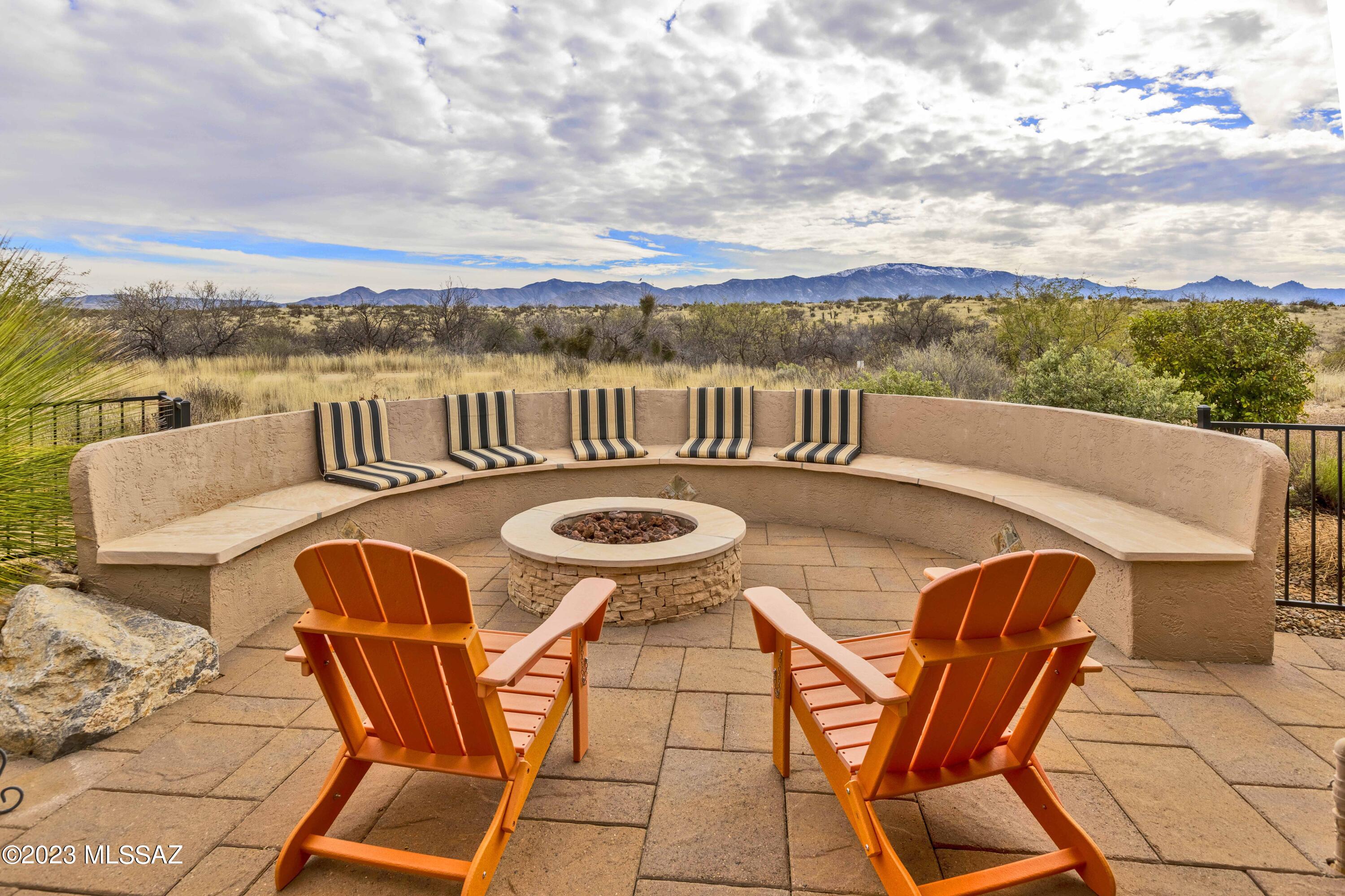 Amazing Views! This Lightly lived in Dolce Floorplan offers the best combination of Catalina mountain views & private fenced backyard. Built w/all the upgrades shown in the original model. Bay windows extensions & custom plantation shutters. Beautiful Alder Kitchen cabinets w/roll out drawers; Ceramic tile surrounds in Baths; Great Room & Den have custom-built entertainment & desk unit. Large patio w/seating for 12 & firepit.  Back gate to access adjacent nature trail.  4' extended garage w/golf cart garage, water softener. HVAC upgraded in 2022; Sprinkler drip system replaced in 2021. Add to that the wonderful amenities of this premier active adult community w/golf, tennis, pickleball, indoor & outdoor pools, fitness center, on site restaurants.  Why wait when you can have it all today!