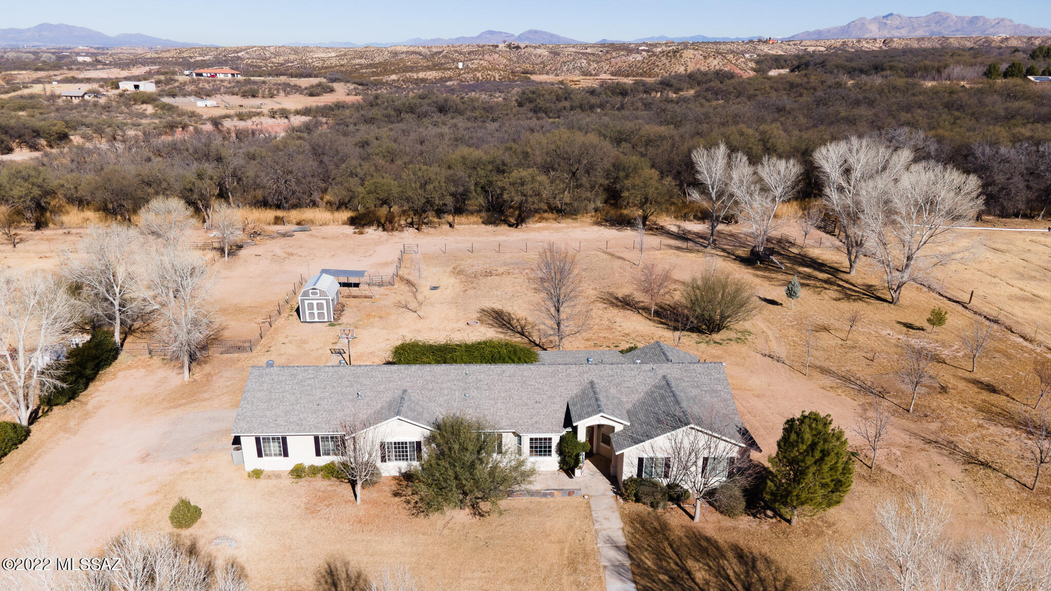Charming custom built home located in the heart of St. David! This home sits on 2.52 acres with plenty of room for horses or to build a shop!  This 3 bed 3 bath + a den house features a very welcoming open floor plan with vaulted ceiling, granite counter tops and slate tile in the
kitchen, a second living area with bay windows and seat, over-sized room that could be used as a game room or man cave, large master suite with garden tub and shower, oversized patio and two storage rooms! The exterior has several mature trees, lots of grass with sprinkler system, a pasture to keep your horses and a 3 carport area that could easily be converted to a 3 car garage. Country living yet close to St. David schools and about 10 minutes from Benson.  This beautiful home won't last long! Call TODAY!