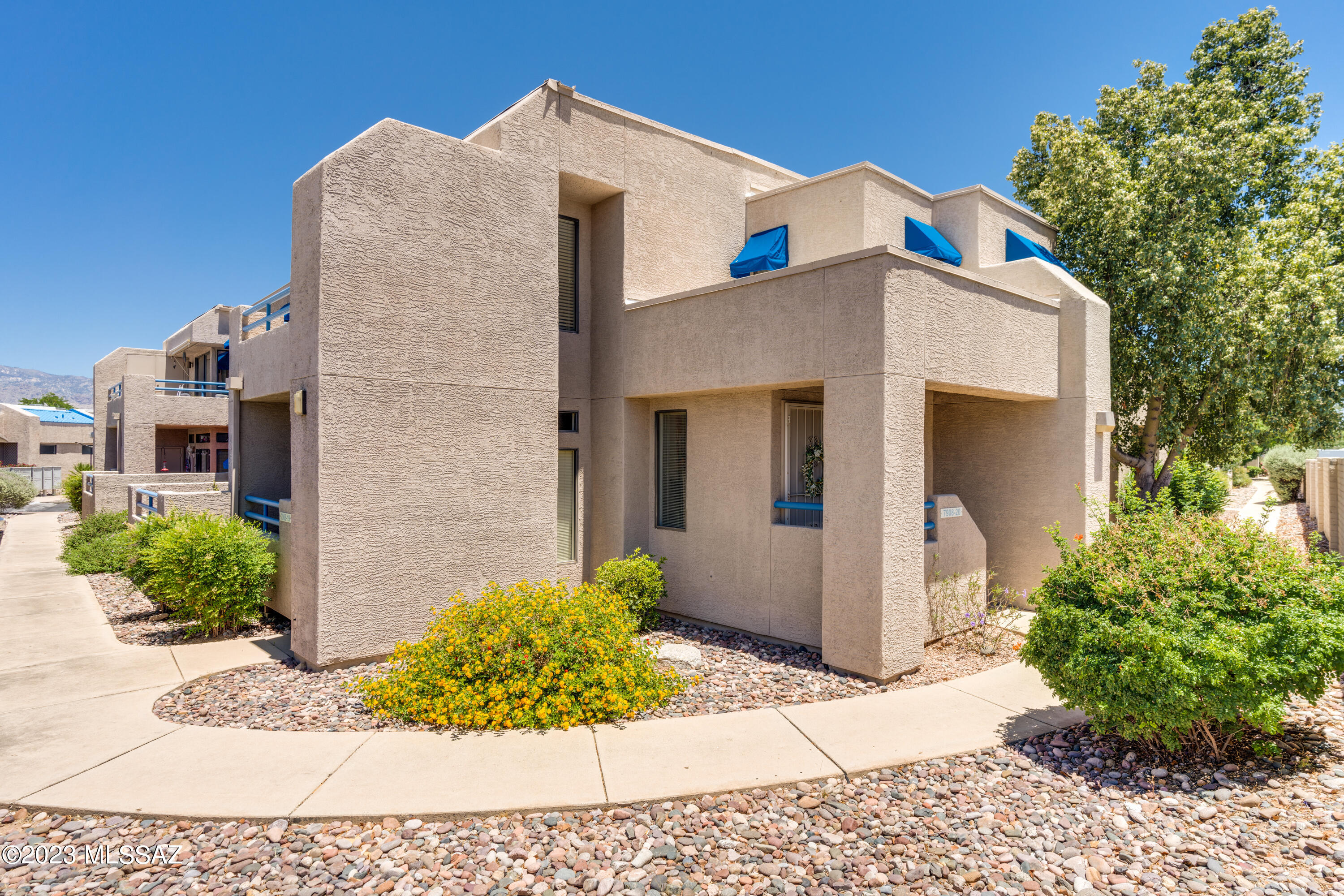 Aside from the spectacular Catalina mountain views you will enjoy every day from the balcony, this two bedroom/two bathroom 2nd floor Condo is move-in ready.  Great starter home for the first time Homebuyer, an investor or the wordly traveler!  Easy to lock up and go.  This Condo features brand new flooring, brand new stackable Washer/Dryer, neutral colored paint and much more.  Fantastic eastside location close to shopping, restaurants and recreation.  Monthly HOA fees include water, sewer, trash, roof, exterior pest control and common area maintenance.  Designated covered parking space included. Two pools with one heated year round and spa.   Welcome Home!