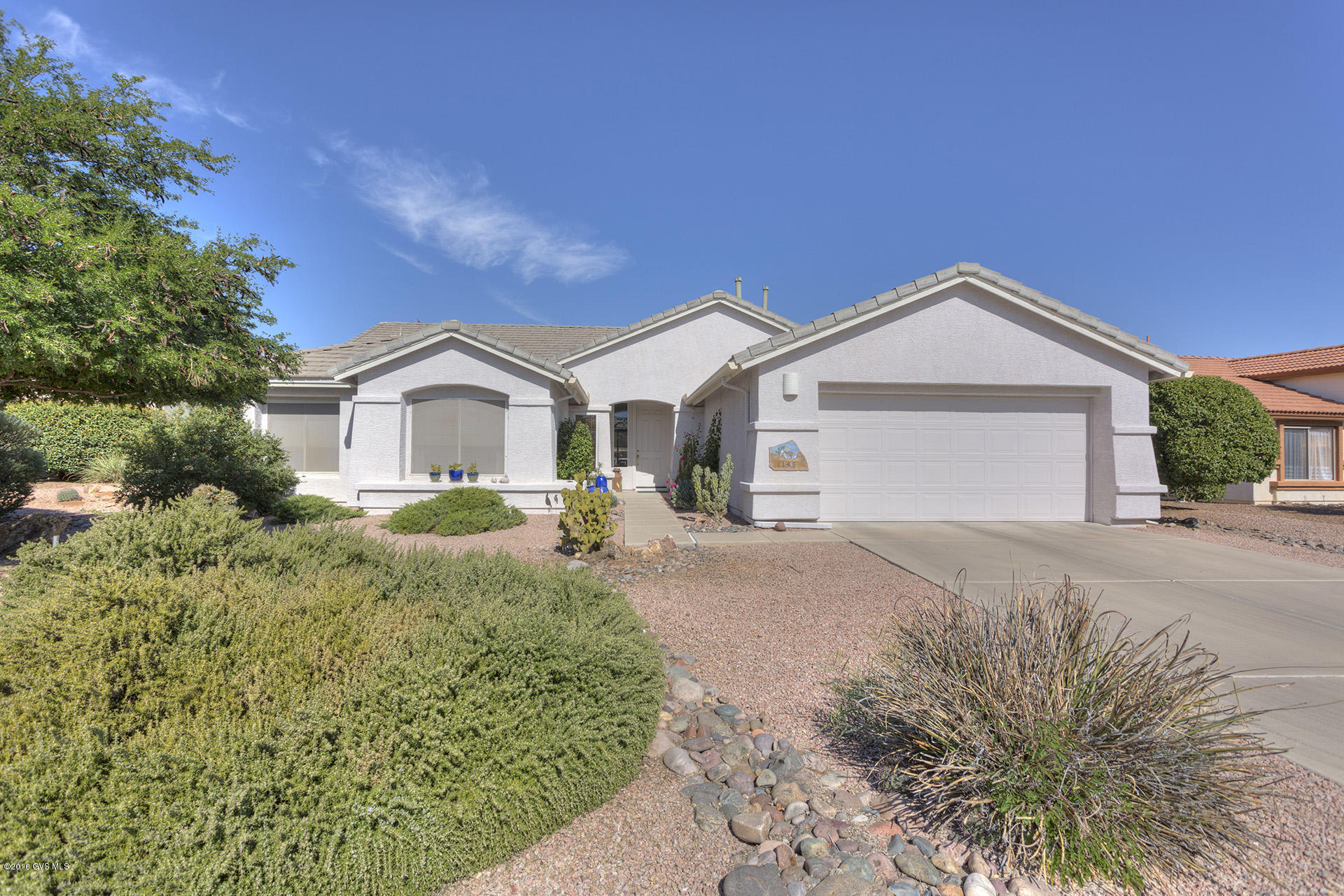 What a great home for casual living and entertaining! When you enter the front door, the open floor plan looks out to the large, private back yard. The interior is finished with soft hues - stay with the mood or throw in splashes of color. You will love the kitchen complete with corian counter tops, roll-out bottom drawers in the lower cabinets, under cabinet lighting and a gas range; the island has an eating bar. The master suite has a bay window overlooking the back, oversized room with lots of space for all your furniture and a reading area; the bath has dual executive height vanity, a large shower and a walk in closet. The den is located just off the front door. Two guest bedrooms are at the front of the house and you can use one for a hobby room-south facing so plenty of light.  This meticuloulsy maintained home has 2 x 6 construction with extra insulation, ceiling fans, solar shades in the back, and two zone heating and cooling all make this energy efficient. The back has a long covered patio, mature landscaping and a one of a kind curvy stucco finish wall. The house has gutters and downspouts. Nothing has been left undone, waiting for you to start enjoying the good life! (Just around the corner from all the amenities Quail Creek has to offer) LANDMARK HOME WARRANTY