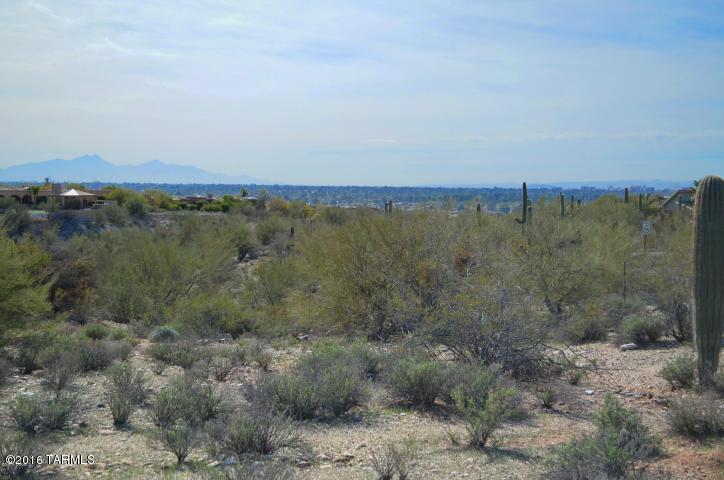 The UPSIDES of DOWNSIZING . . . Here it is….an easy, nearly flat building area with BREATHTAKING views of city nightscapes, UA and Mt. Wrightson - even to Green Valley!  A wide-berthed natural OPEN SPACE CORRIDOR preserves these views!  Minimum site prep with a pre-determined building envelope ideally sited to also capture the SPRAWLING CATALINA MTNS and a poke of sunsets.  Located in a quaint 12-lot GATED COMMUNITY off Hacienda del Sol for easy access to UA, downtown, the finest in shopping/restaurants.  BIG SAVINGS = water METER is IN!  Can walk lot from Country Club Rd. Between EXISTING BLOCK WALL and orienting home similar to adjacent home to east will defer what little road noise there is; imagine you’re IN a home, not walking open land.  Easement granted for neighbor's driveway