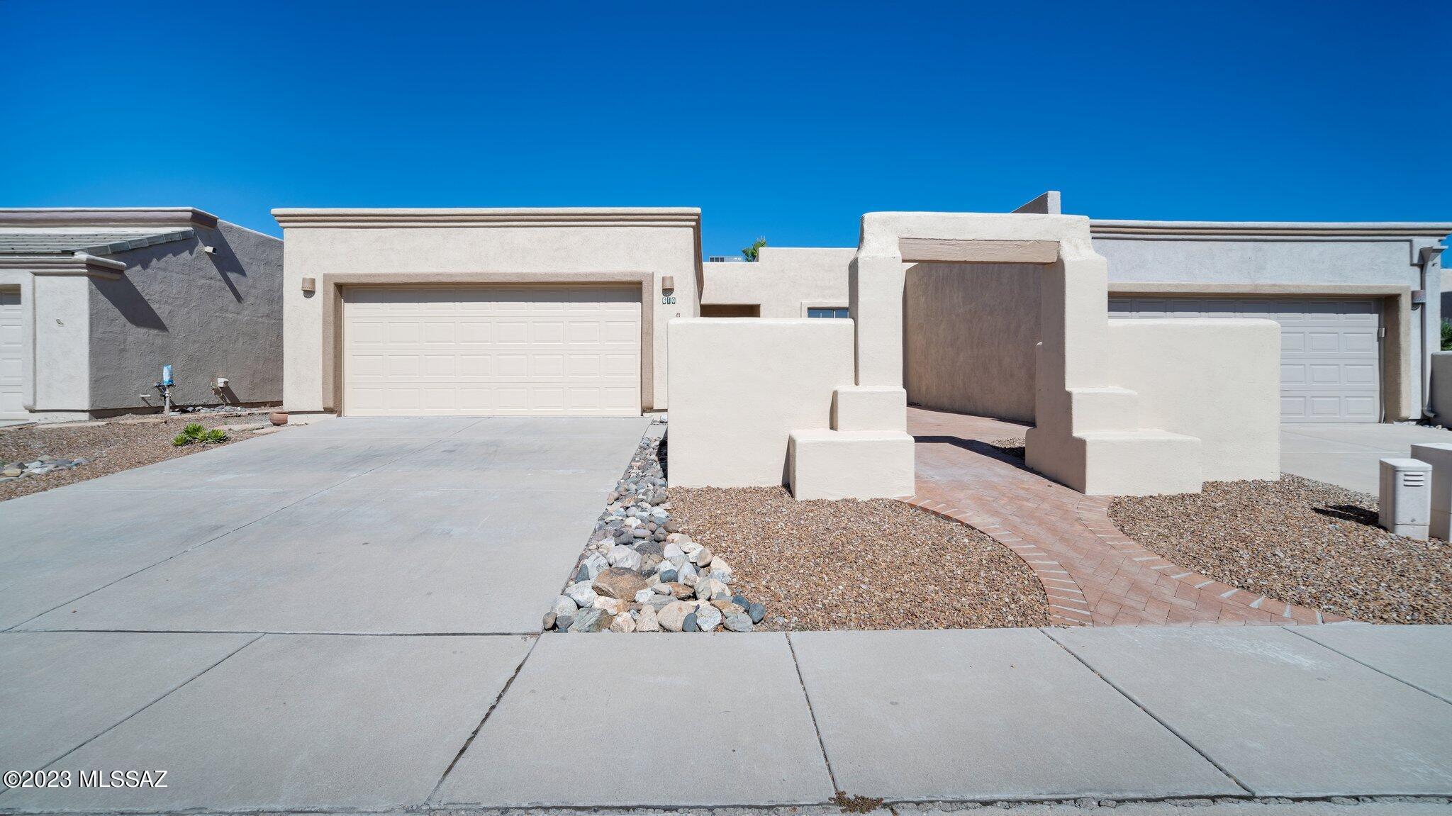 This beautifully updated townhouse has a host of enticing features and improvements that make it a true gem. Nestled in a tranquil neighborhood, this property offers both comfort and style. Meticulously maintained, from a newly re-coated roof to fresh interior and exterior paint, this residence exudes modernity and charm. Upon entry, you're greeted by new Luxury plank vinyl flooring, which adds warmth and character to the living spaces. The kitchen is the heart of this home and has a southwest flair with wooden beams gracing the island. The kitchen also features a gas range, ensuring an enjoyable cooking experience for any culinary enthusiast. An additional bonus room offers versatility - it's perfect for an office, den, exercise space, or as a creative hub for crafts and hobbies. The Guest bathroom is a haven of relaxation with a walk-in jetted senior bathtub, making it ideal for unwinding after a long day. The living area is centered around a charming beehive fireplace, creating a cozy atmosphere for those colder evenings. Step outside into the front courtyard and discover a peaceful oasis that's perfect for enjoying your morning coffee or evening tea. The two-car garage houses a washer and dryer for your laundry needs. 
This townhouse truly offers a comfortable and convenient lifestyle. With its numerous upgrades and thoughtful design features, it's a must-see property that combines modern amenities with timeless appeal. Don't miss the opportunity to make this your new home!