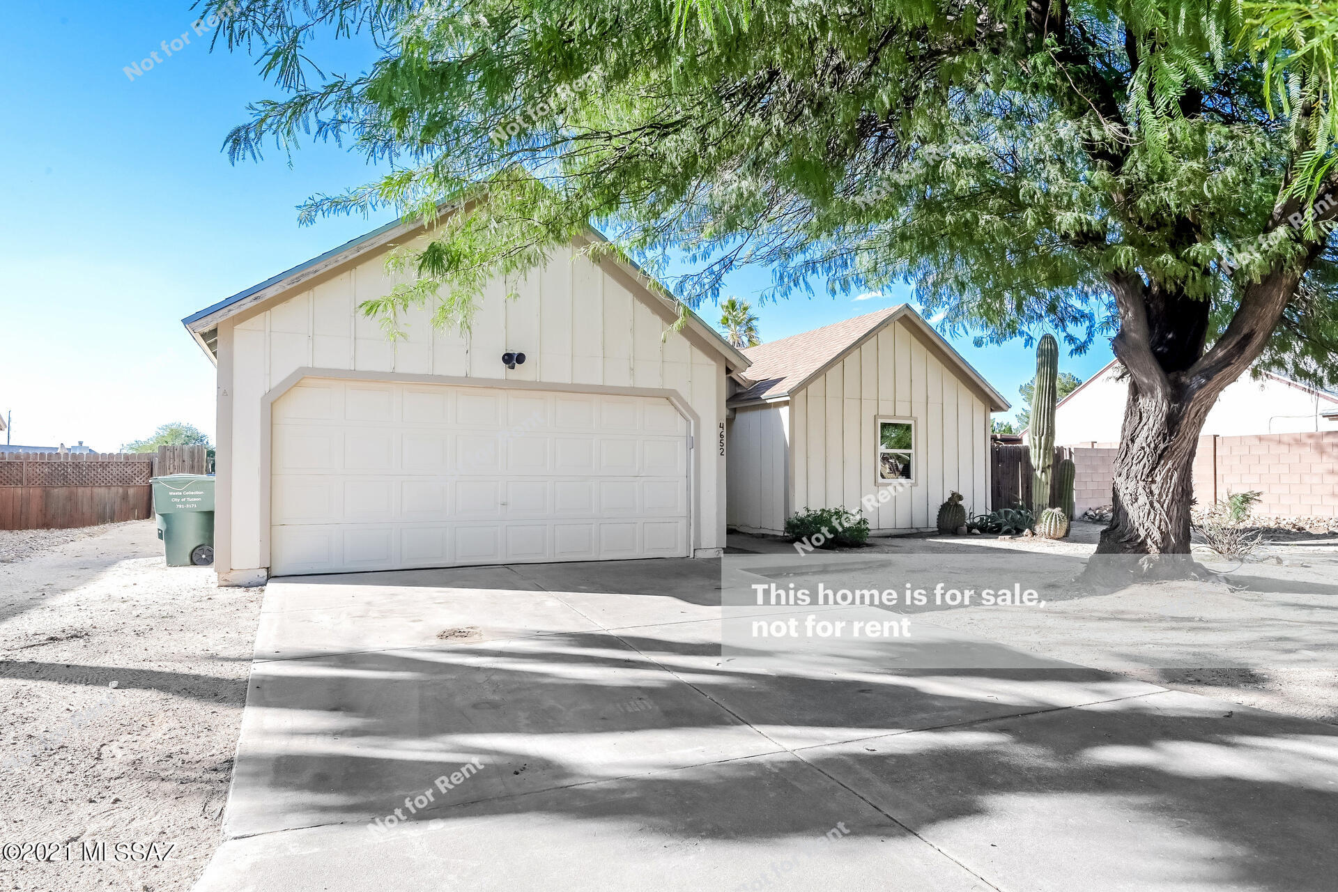 This Tucson one-story home offers a patio, and a two-car garage.