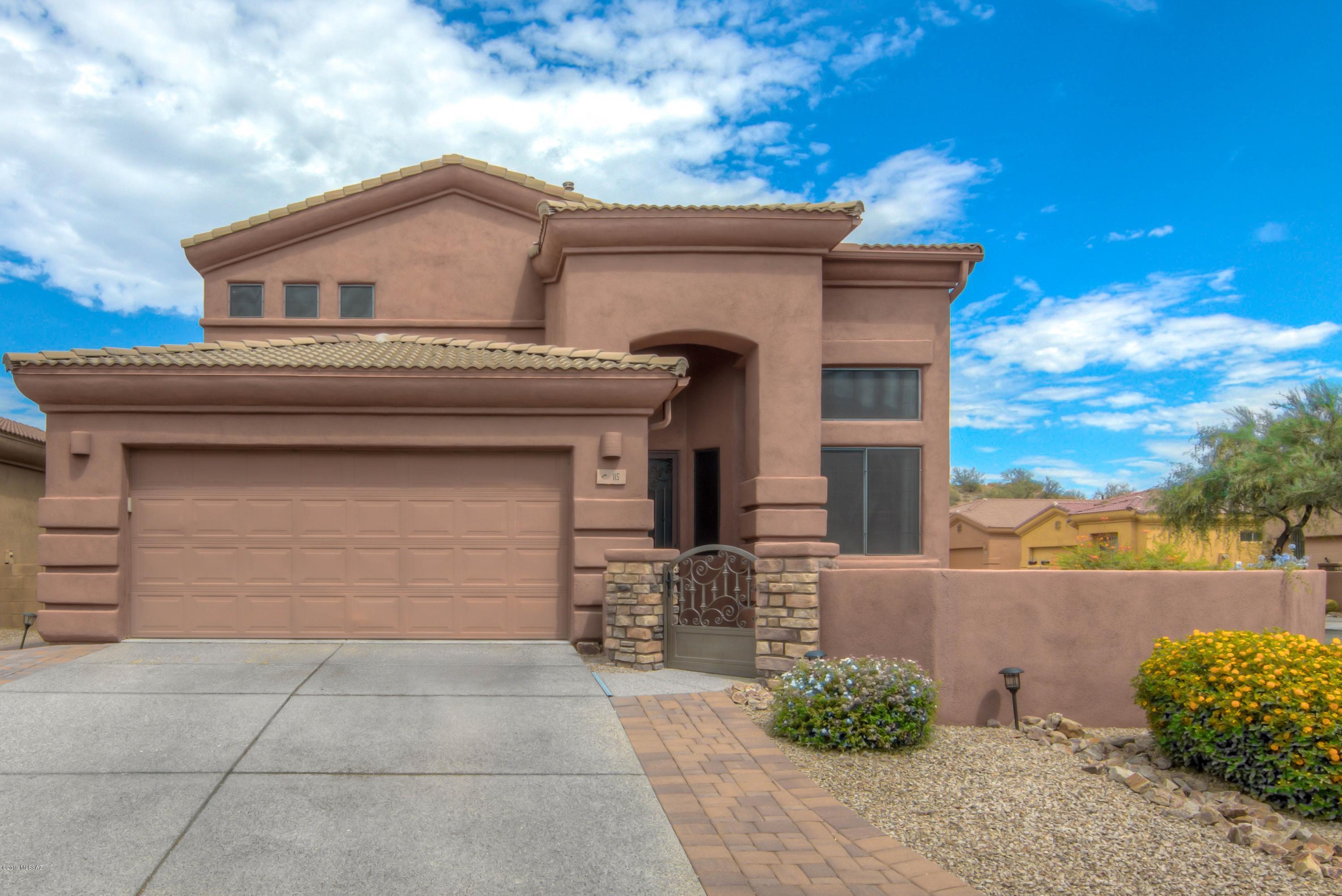 Gorgeous, upgraded 4BR/2.5BA + loft (2,219 sq. ft.) home with sparkling pool located in the heart of Oro Valley. PUSCH RIDGE VIEWS from gated front courtyard. Open concept floor plan for modern living. Entertain in the chef's kitchen boasting stainless appliances plus granite counter tops and plenty of storage. Great room with patio access opens to kitchen. Over-sized master suite featuring luxurious master bath with dual vanities, garden tub and walk-in shower. Other features include new pool pump, newer AC/furance, newer exterior paint, beautiful tile & wood floors, loft and living/dining room.  Outdoor living at its finest!  Lovely rear yard is highlighted by a sparkling pool w/waterfall, faux lawn and extended brick pavers. Walk to 30-acre Riverfront Park. Views!