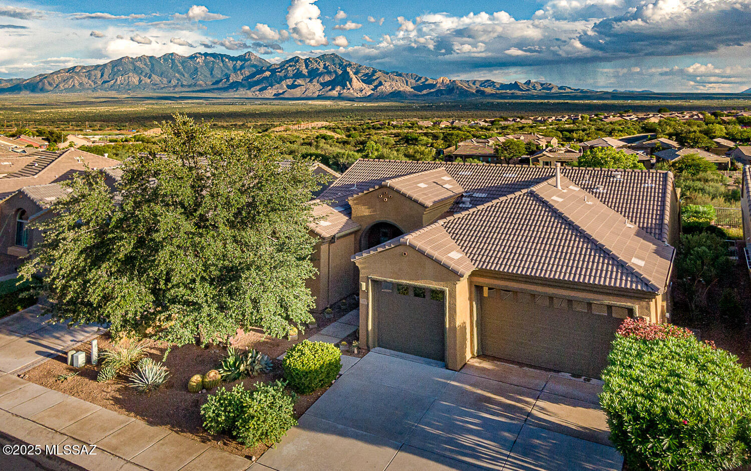 Enjoy stunning mountain views from inside and out! Open concept floorplan with no wasted space feels larger than its stated size and offers a light, bright ambiance throughout. Features include a kitchen with tons of cabinetry, gas cooktop, dining nook with views, and a butler's pantry. The formal dining room is perfect for hosting family and friends, while the open den adds flexible space for work or relaxation. The split bedroom layout ensures privacy. Spacious primary suite with mountain views, patio access, a large walk-in closet, garden tub, and separate shower. Architectural details like arched doorways, arched doorways and decorative niches,  ceiling fans throughout. Enjoy Arizona living with low care landscaping, a pool with stunning views, 3 car garage with 4 ft extension... plenty of room for vehicles, storage, or hobbies. This home is an exceptional find! light, bright, and move-in ready. And just imagine yourself floating in the pool while taking in the sweeping views! Come see for yourself!