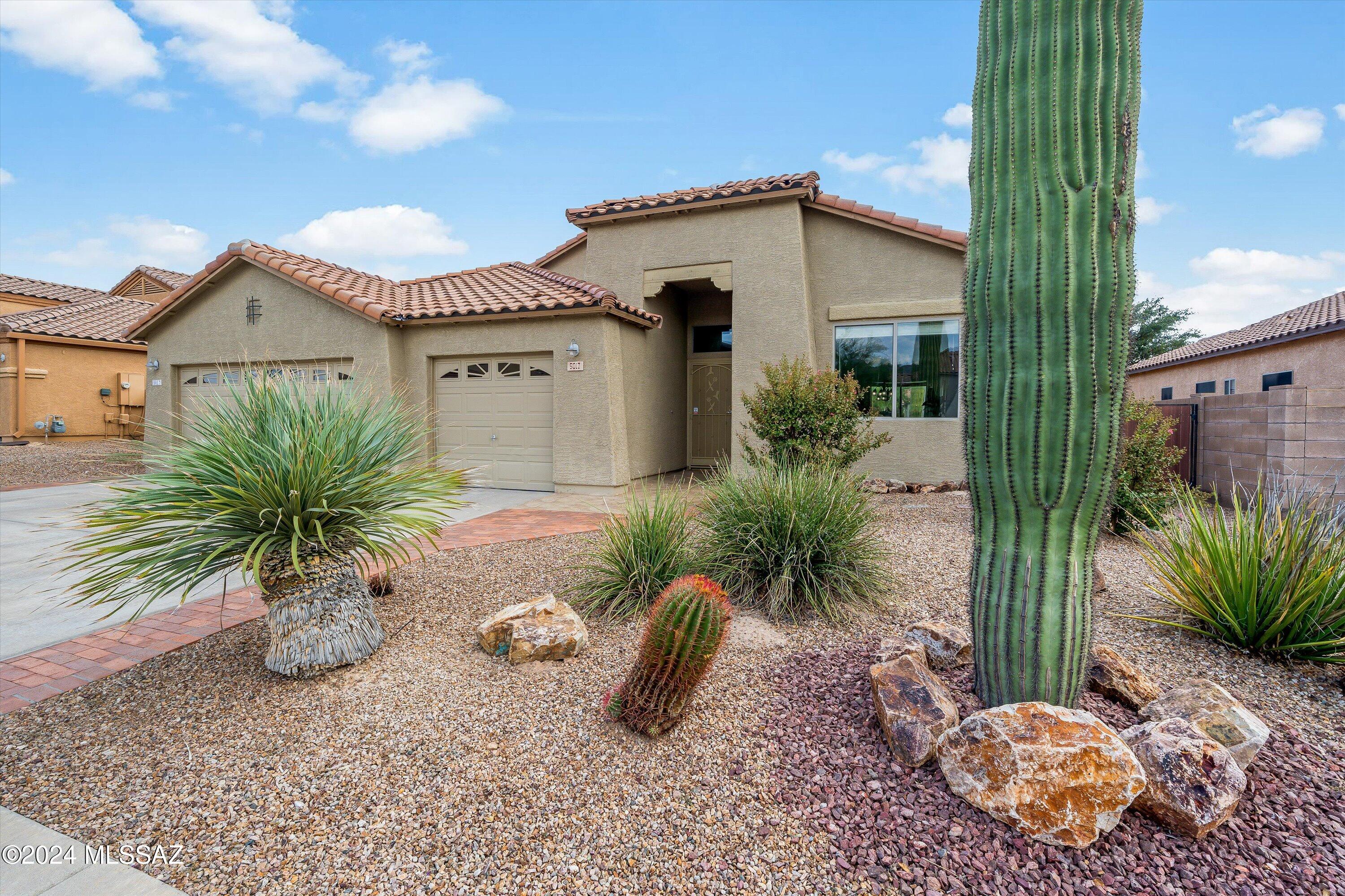 HIGHLY MOTIVATED SELLERS!  WILLING TO OFFER $12K IN CONCESSIONS!

Welcome to The Best Value on Dove Mountain! Dove Mountain-Quail Crossing - LESS THAN 5-minutes from Dove Mountain Stem CStem School, VERY near The Gallery @ Dove Mountain, and 10-minutes from the Ritz Carlton Resort - Something for everyone! Charming and meticulously maintained 3-bedroom, 2-bathroom home with 2,086 sq. ft. of living space, situated on a generous lot featuring a serene water fountain, with beautiful Tortolita and Catalina views. This home offers a split floorplan with TWO living spaces, plus a dining room designed for privacy and ease of living. The original owners have taken exceptional care of the property, offering almost new mechanicals, and updates galore! This is perfect for a small family, snowbirds, or empty nesters looking for a resort community  

Highlights of the property include - High ceilings, an open floorplan, with upgrades and special touches in each room. - An updated Kitchen with stainless appliances, granite counters, built-in desk, and a prep island with a breakfast bar. - The Primary Suite features an Ensuite Bathroom with a shower and soaking tub. - A surround sound system indoors and out, perfect for entertainment. - A 3-car Garage built for hobbies with extensive storage, a workbench, and updated electrical! Enjoy the beauty of Dove Mountain, while relaxing in a home that combines comfort, style, and functionality. You will not find a better value in the area.