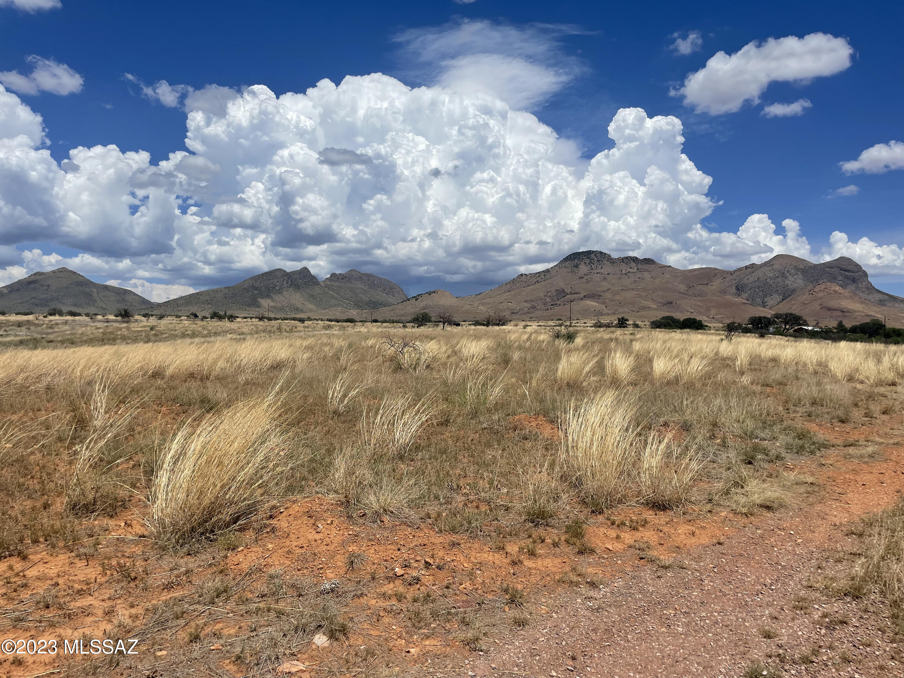 This lot overlooks the Elgin Valley and the Mustang Mountains in your back yard.  A large private ranch borders to the north and this acreage is very close to BLM and state land for hours of riding and hiking pleasure. The Babacomari River winds beside and behind the property bringing that true country feel. The lot is great for building your dream home with amazing views and no restrictions!