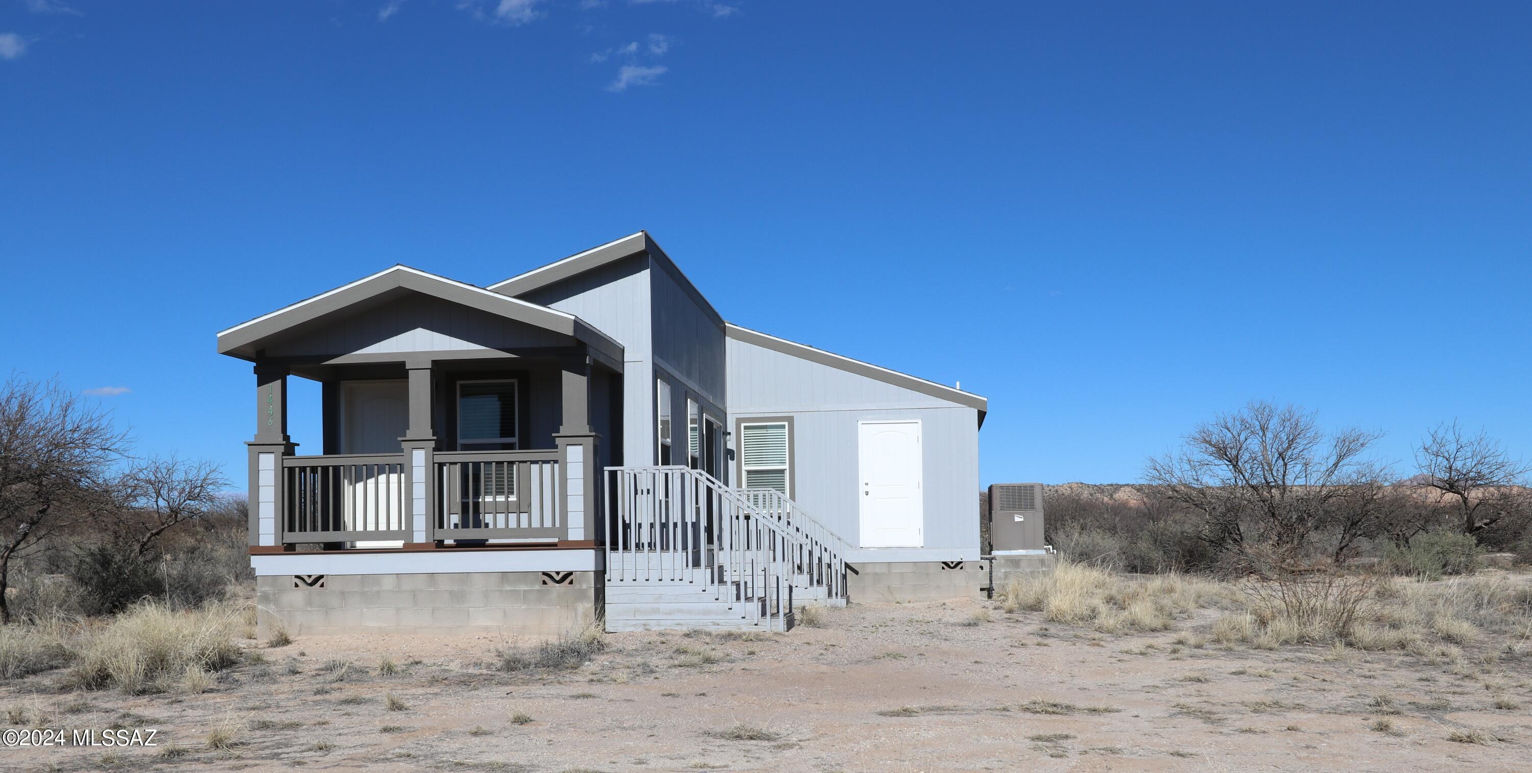 New CAVCO manufactured home on a large 2.73 acre lot located just outside Benson, AZ. Almost 3 acres !! This home has been lived in for 3 weeks. City water. electric. Gorgeous mountain views. Near interstate 10 with easy access to Tucson, a 30 minute drive. This property is located in Cochise County, AZ and has a mild climate. 2 bedrooms, 2 baths. Storage shed. Move in ready. A must see.
