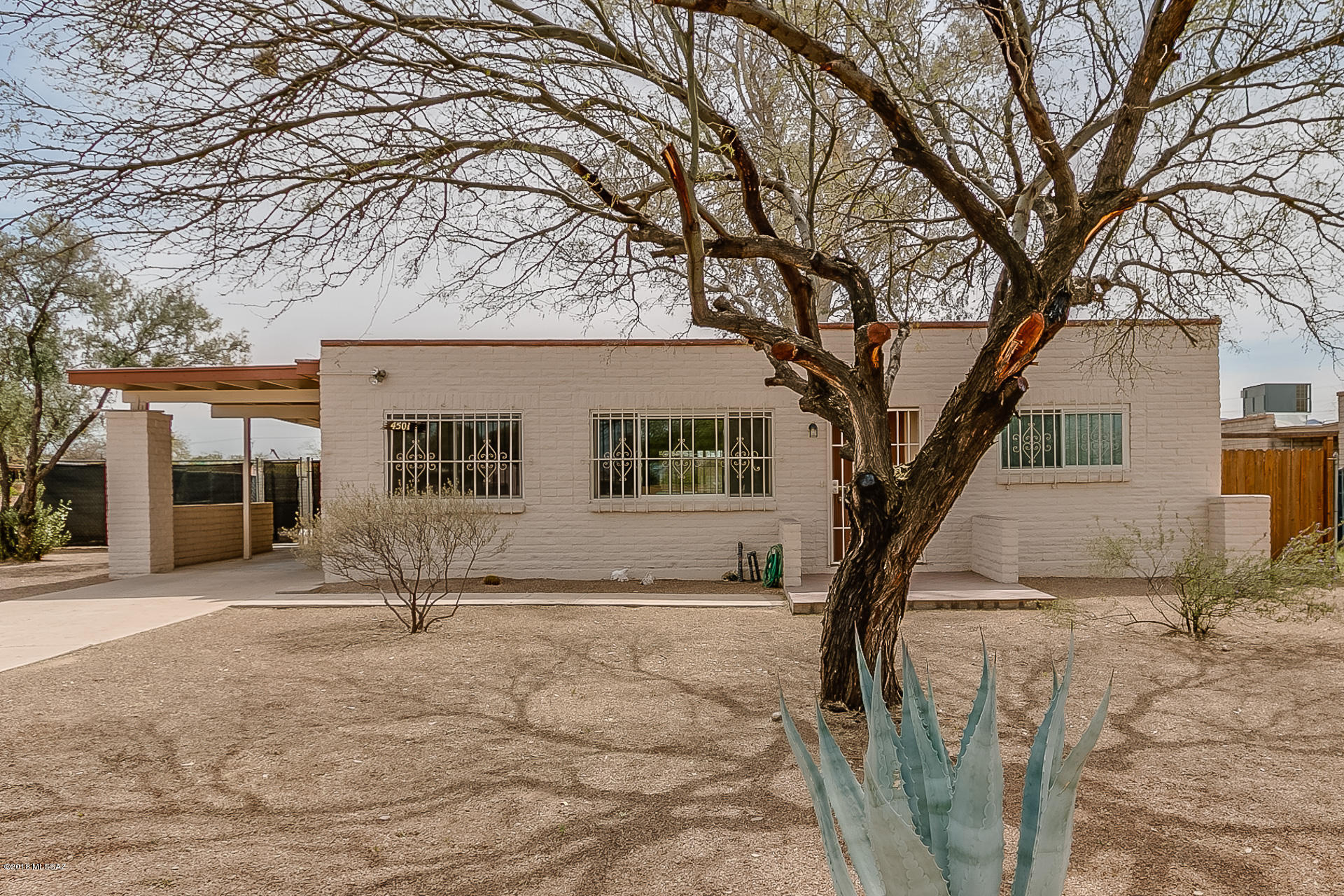 Great home  in Northwest Tucson at a price that is hard to beat! This home is situated on a large corner lot. Conveniently located near great restaurants and shopping. Includes newer carpet, recently painted inside and out, energy efficient doors and windows, and gorgeous stainless steel appliances. The large back yard has lots of potential. Laundry is in attached carport storage room. Security bars on windows for added peace of mind. Come check it out before its gone! Sellers have not lived in the home. No Clue Report will be provided.