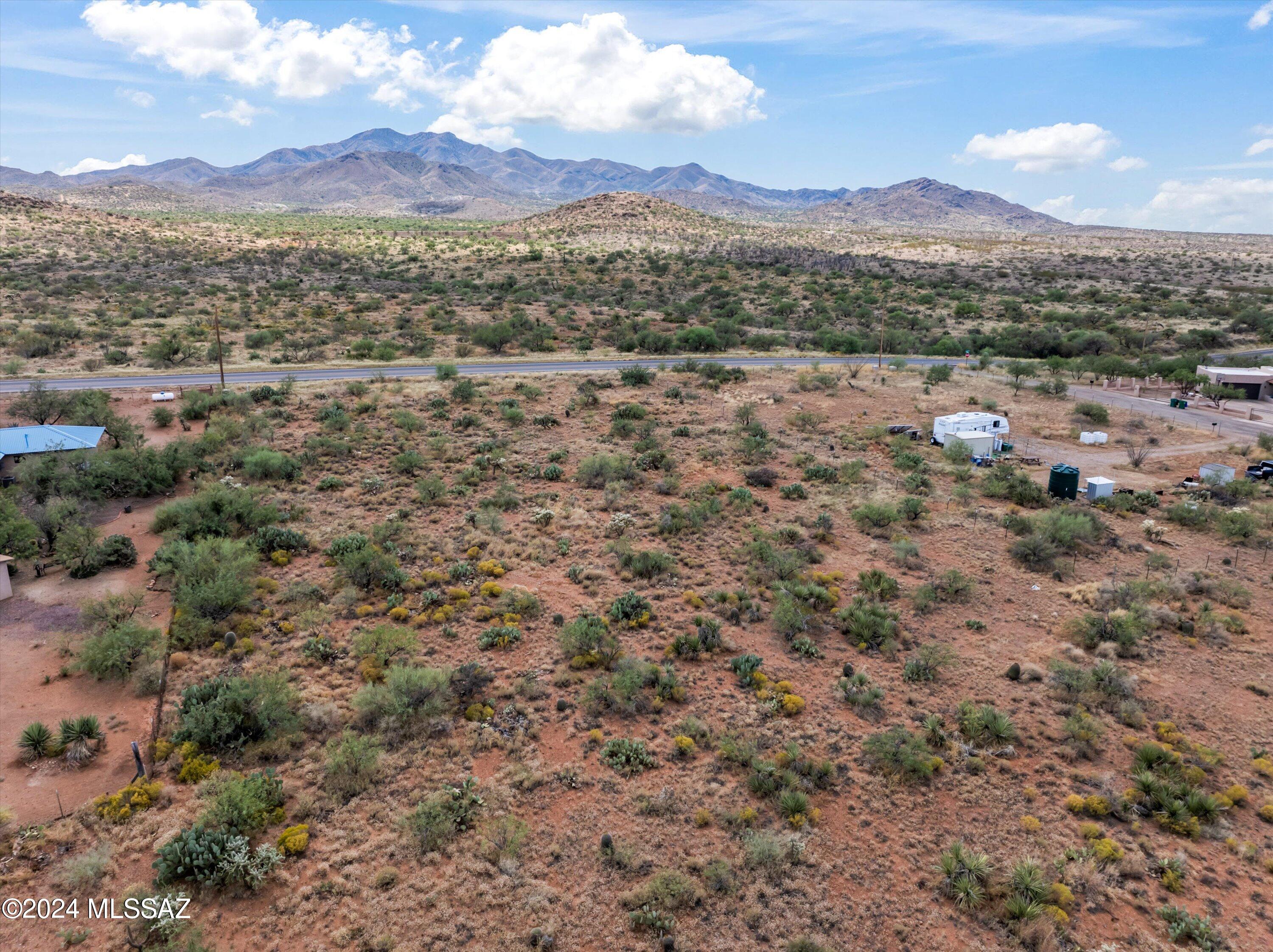 Enjoy this beautiful lot of land that has fantastic views of Mount Fagan in the Santa Rita Mountain as well as Ricon and Mica Mountains. This lot is approximately 1 acre and zoned CR-1. This lot is situated on the north side of E Sahuarita Rd, a paved road. Electric service is available with TRICO and the electrical box sits on the corner of the lot. This is area is well-known for its peace and quiet as well as the Vail school district.  This is a great area to build a home and settle in!!