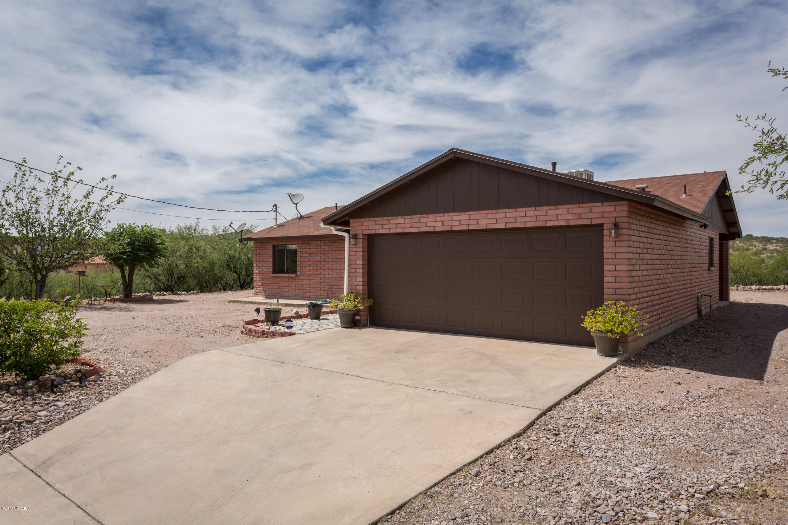 Exceptional home located on premier 1.23 acre lot with remarkable views of the surrounding Santa Cruz Valley! Features include concrete driveway, two car garage, wood flooring in bedrooms, gas stove, two full bathrooms, laundry room, window shutters, and covered back patio! Pride of ownership at its finest!