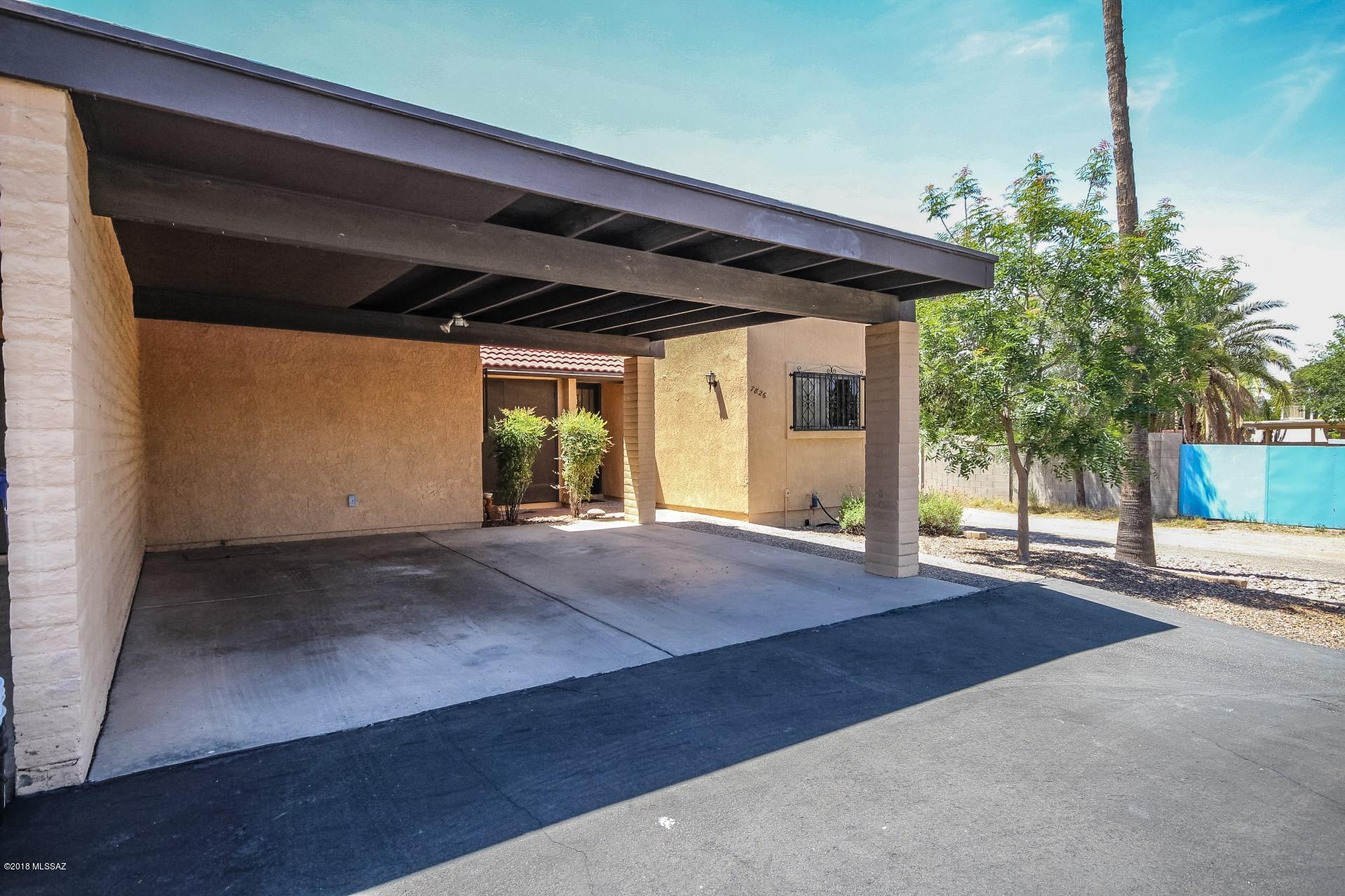 Tidy as a pin, welcoming, inviting and in great condition, this end-unit townhome is also quiet and private. The beehive fireplace and open concept floor plan will impress, as will the many updates to kitchen (SS appliances), bathrooms, flooring and lighting. Enjoy the low-care walled-in back yard with covered patio, mature trees & ample shed. Verde Vista Villas is a well-run and maintained complex, conveniently located off Pantano Rd, north of Speedway. Check out its common areas and beautiful community pool with ramada. Washer & dryer convey.