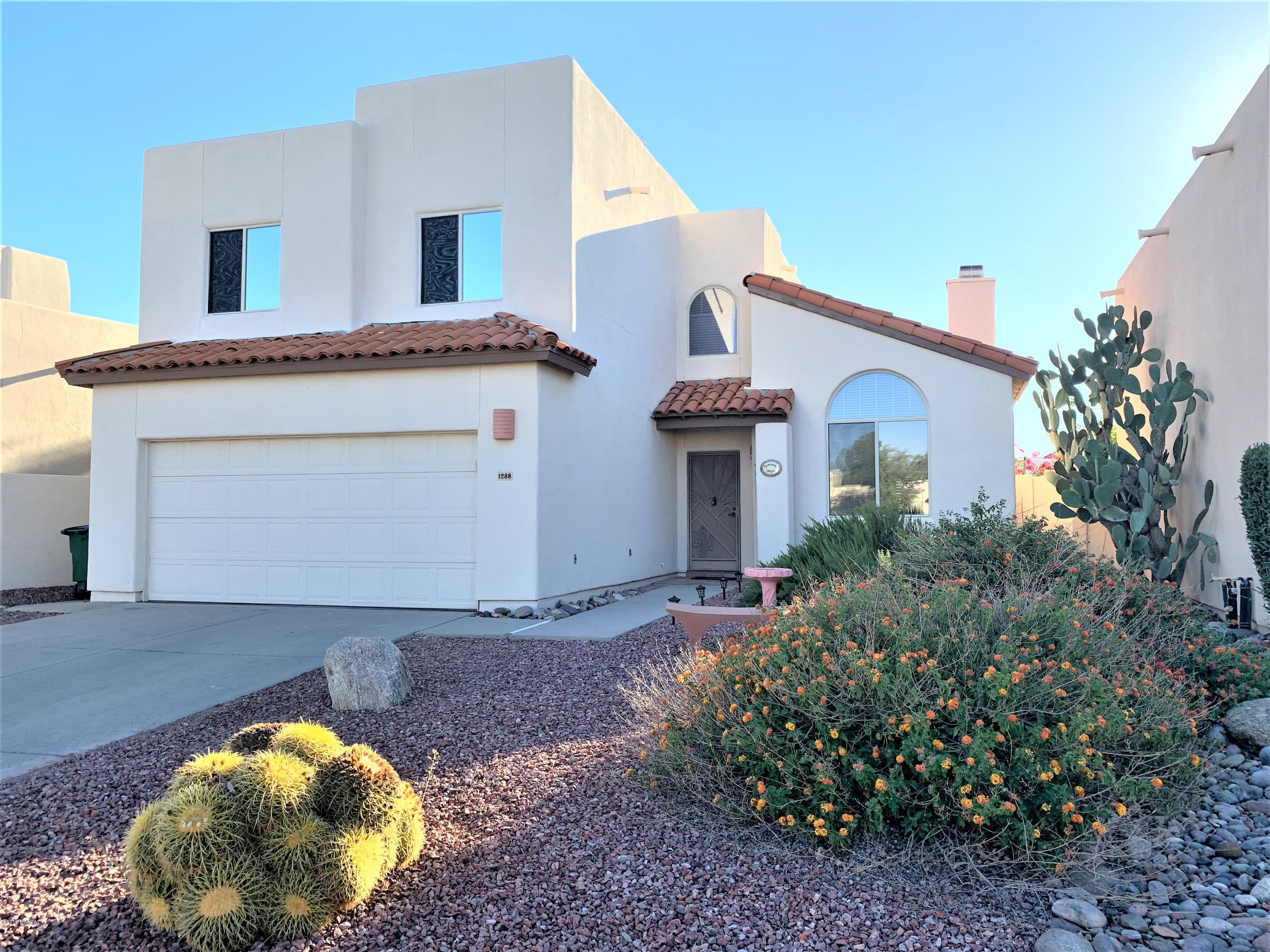 What a FIND!! This bright and open three bedroom + LOFT, 2.5 bath features Tile or laminate flooring everywhere but bedrooms, custom tile countertops in kitchen with breakfast bar connecting to family room. Double doors lead out to the large covered patio with low care landscaping. Mountain views from your patio, yard, and master deck! Another living area includes fireplace, and a powder room downstairs. CLEAN Two car garage with cabinets and freshly painted floor. Upstairs you will find 2 bedrooms, loft space with a closet, PLUS the owners suite. Owners suite features a private deck, walk in closet, spacious shower and is separated from the other two bedrooms by the loft! 
Coveted cul de sac location in Oro Valley at this price??  This property wont last long.
