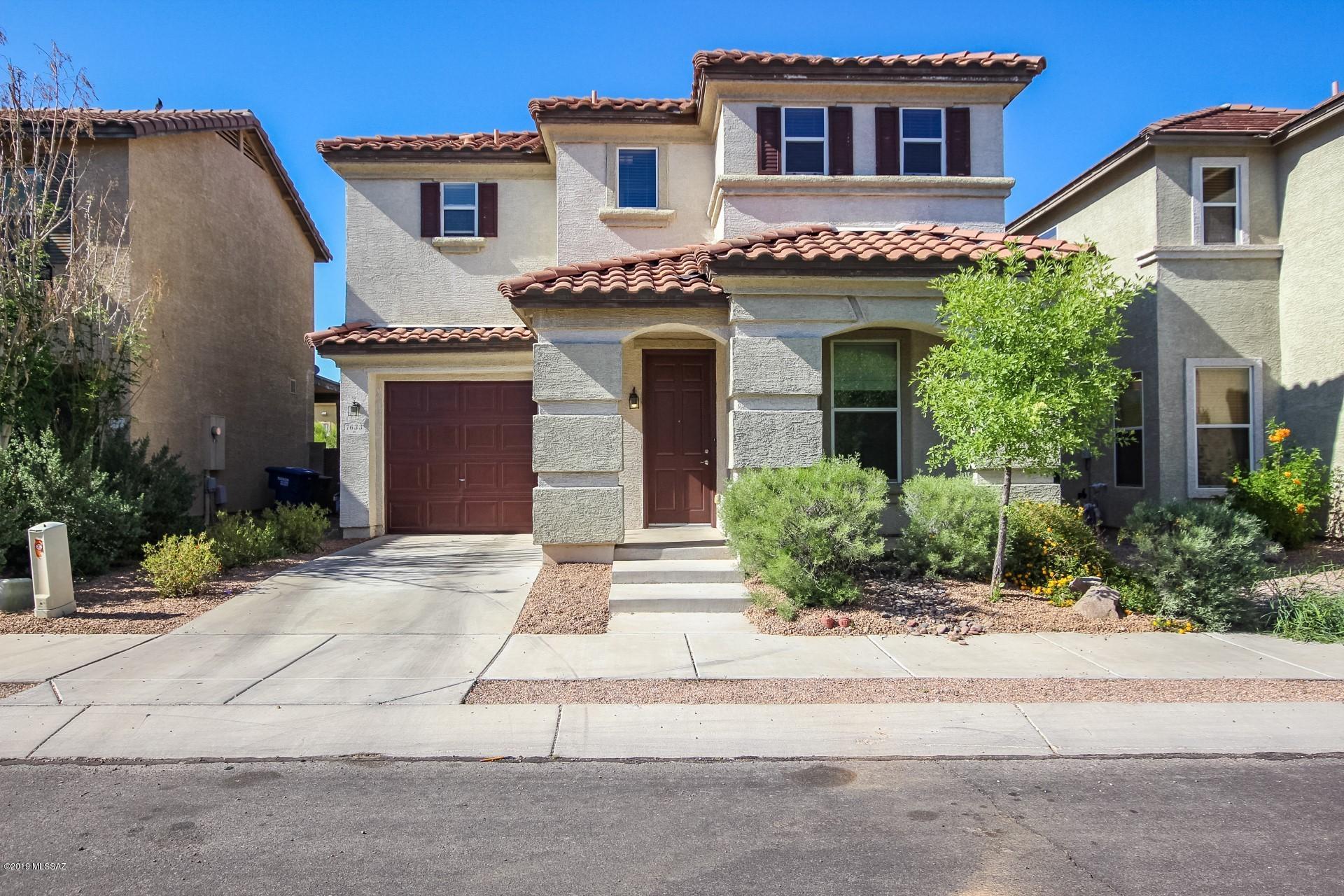 This exciting move-in ready home, featuring a newly painted interior throughout, boasts a large open layout downstairs with living room, den, 1/2 bath and under-stair storage room, and a BIG eat-in kitchen with pantry. Bring your extra large family to the dining table. Gorgeous tile counters, cherry cabinets, black Whirlpool appliances, custom upgraded fixtures, wood blinds and ceiling fans throughout the home. Four bedrooms upstairs boast brand new carpeting throughout and master has en-suite bathroom and walk-in closet. Large sliding doors lead to a cool covered patio with enclosed privacy block fence. New low-maintenance decorative landscape rock in the front & back yards.