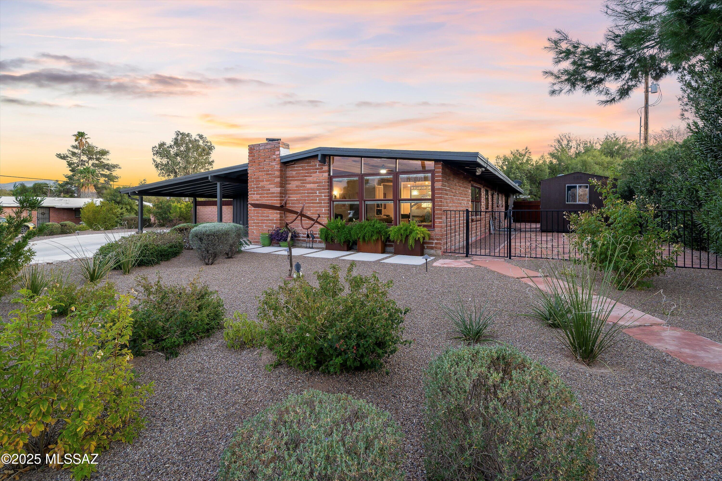 RANGE PRICED $739,900-$759,900. This is the ONE you have been waiting for! A spectacular home in the desirable Indian Ridge Estates that has it ALL! Completely remodeled from the inside out & still holds it's charm with exposed wood beam ceilings and charming finishes & exterior. There is a newer solar heated swimming pool with a self cleaning system, & a new 576 SF workshop/studio with electrical & heating/cooling! Absolutely nothing will have to be done, you can move right in. This 3 bedroom 2 bath home features remodeled kitchen & bathrooms with granite countertops & real wood dovetailed cabinets. Kitchen features stainless steel appliances, tiled backsplash, pull-out cabinet drawers, a composite sink & open sight lines to the dining/living rooms. There is new Luxury plank flooring throughout the entire home & new carpet in the bedrooms. Newer windows, new extended sliding glass doors in living room and Primary bedroom, a new water heater & HVAC too! Situated on an over 17,000 SF lot, there is plenty of driveway space with a newer large concrete driveway with additional parking pad to the side of the carport, newer professional landscaping in both front & backyards, beautiful mini pebble refreshing pool & a new covered porch to relax & enjoy your company. There is a 10x20 storage shed in excellent condition. Excellent location with proximity to shopping, restaurants, schools, Sabino Canyon, & more! There is just too much to share, you must see this one before it's gone!