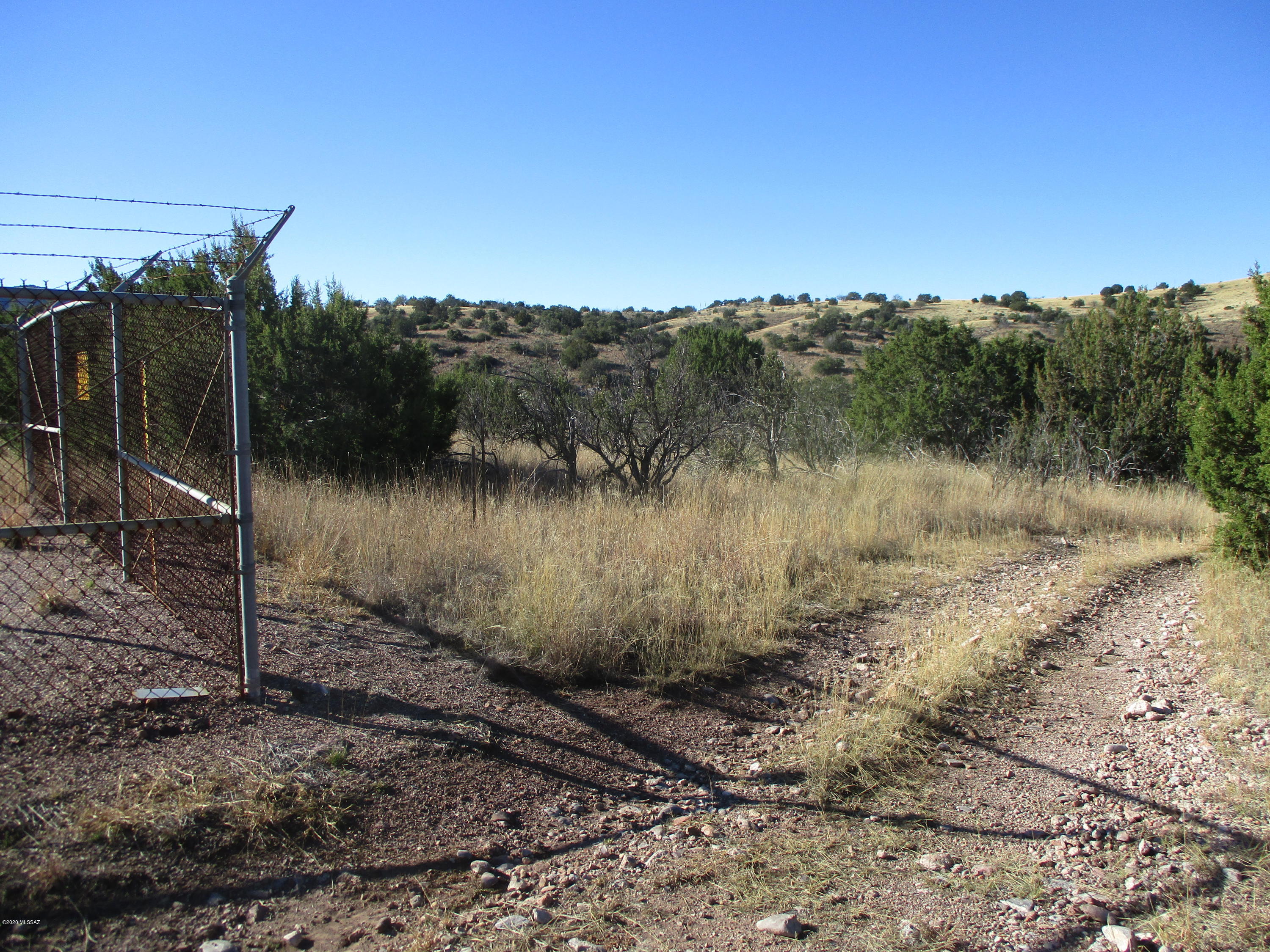 Beautiful 60 + acre parcel in Tunnel Springs, a gated subdivision in Sonoita.  Property has an abundance of trees and a wash running through it.  There is a well at the bottom of the hill.