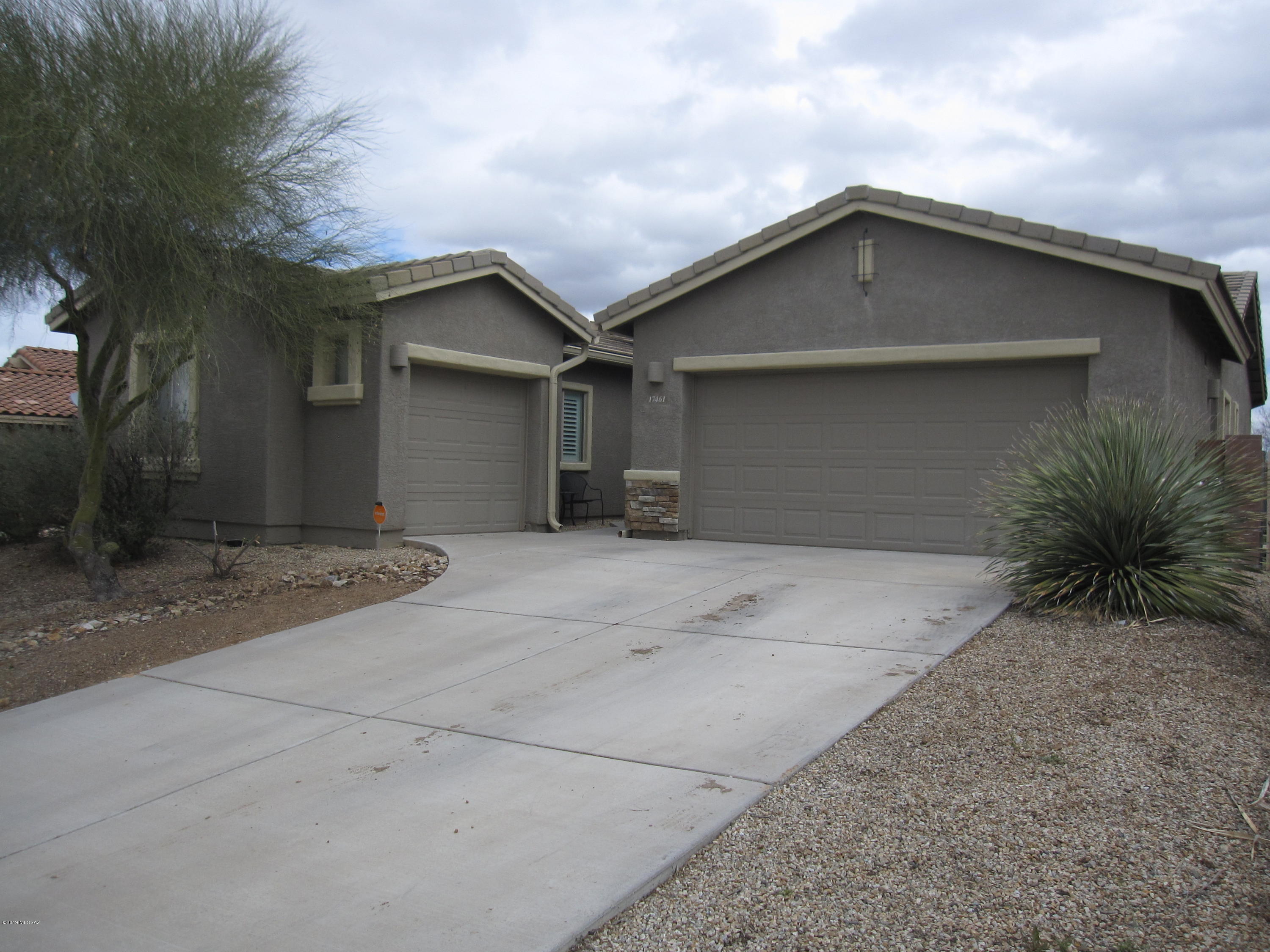 Well maintained and move-in ready home in Sycamore Canyon with a bright open split-bedroom floor plan. Island kitchen with stainless steel appliances and a gas stove/oven. Some of the many other features this home has is a 3 car garage, bay windows in master bedroom and dining room, ceiling fans, water softener, security doors, decorative stone work on exterior and a backyard that overlooks natural desert with mountain views. 3rd bedroom has a Murphy bed. Plus, a community pool & spa, 2 acre grassy area, playground , basketball court, views of Santa Rita & Santa Catalina mountains, and loads of walking paths.