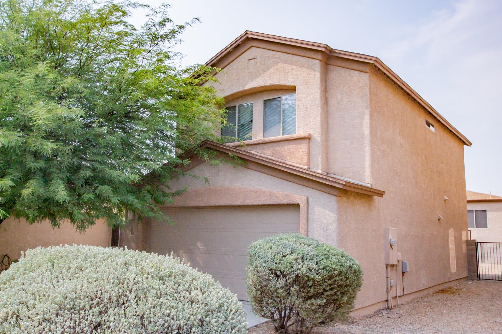 Inviting spacious open floor plan w/plush carpet, soothing palette,  ceiling fans, neutral tiled floors in all the right places, window blinds,  & patio access from the dining area. Plenty of wood kitchen cabinets, pantry, & stylish counters. Perfect home for entertaining. Charming powder room w/pedestal sink.  This pristine home features 3 bedrooms, 2.5 baths, ample closets, & 2 car garage. Large backyard w/a covered patio & decorative stone.  Lots of space for your dream desert oasis. Close to Schools. Will not disappoint!