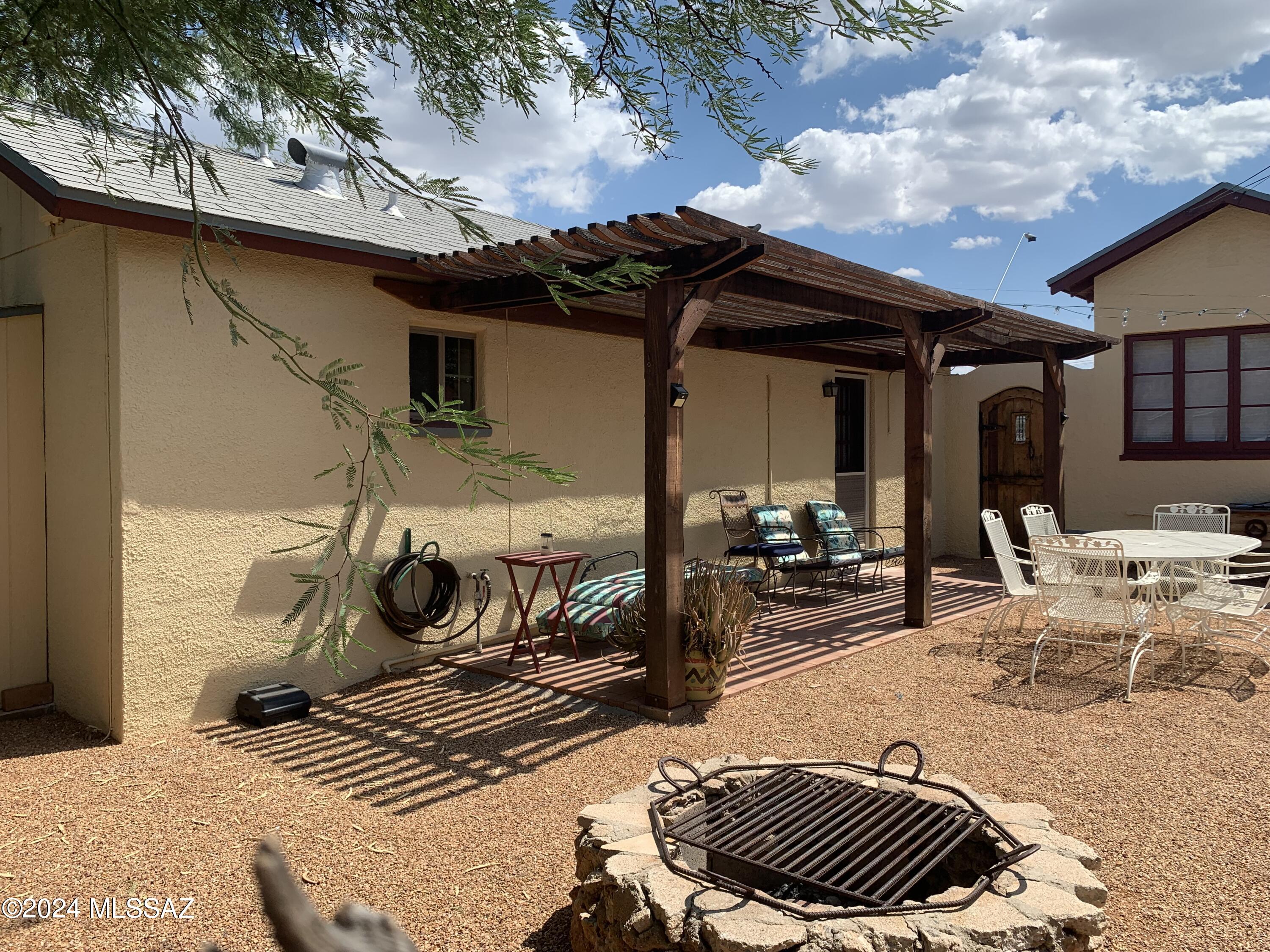 ADORABLE GUEST HOUSE CASITA IN CONVENIENT GRANT/ PARK AREA! CONCRETE FLOORS, TILED COUNTERS, A/C, FRONT BRICKED PATIO W/ RAMADA, FENCED BACK YARD W/ FIREPIT. LOTS OF PARKING IN BACK, WASHER/DRYER & SECURITY SYSTEM. VERY CLOSE TO MOUNTAIN BIKE PATH & ONLY 1 MILE TO UA. RENT INCLUDES WATER, GARBAGE PICKUP & SECURITY SYSTEM MONITORING. FREE STANDING LAUNDRY ROOM IS SHARED WITH TENANT IN MAIN HOUSE. THERE IS NO BUILT-IN STOVE. THERE IS A FRIDGE, MICROWAVE, TOASTER OVEN & PLUG-IN HOT PLATE. LISTING AGENT OWNS PROPERTY & IS LANDLORD.  IT IS CUTE, CLEAN & COZY BUT REALLY ONLY COMFORTABLY ACCOMMODATES ONE PERSON AND POSSIBLY A SMALL PET!