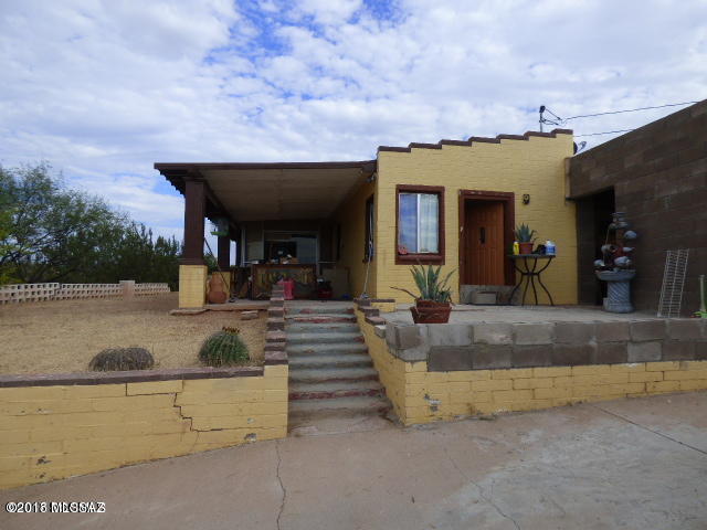 Property is an all-electric three bedroom two bath home block construction, exterior block wall on west side of the property, fireplace, covered patio on .88 acre view lot, paved circular driveway.