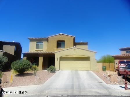 This four bedroom, three full bath, 2,665 square foot gorgeous home sits in the highly sought after community of Rancho Sahuarita. Located within minutes of the community Clubhouse, schools, splash park, sports courts and Sahuarita lake; this home is also situated in a gated community. Features a low care back and front yard along with a sparkling Pebble Tech swimming pool. All kitchen appliance included for your convenience! Also features a downstairs office/den/bonus room. Easy access to shopping, freeway, Desert Diamond Casino and many outdoor activities. MUST SEE!! PRICED TO SELL!!