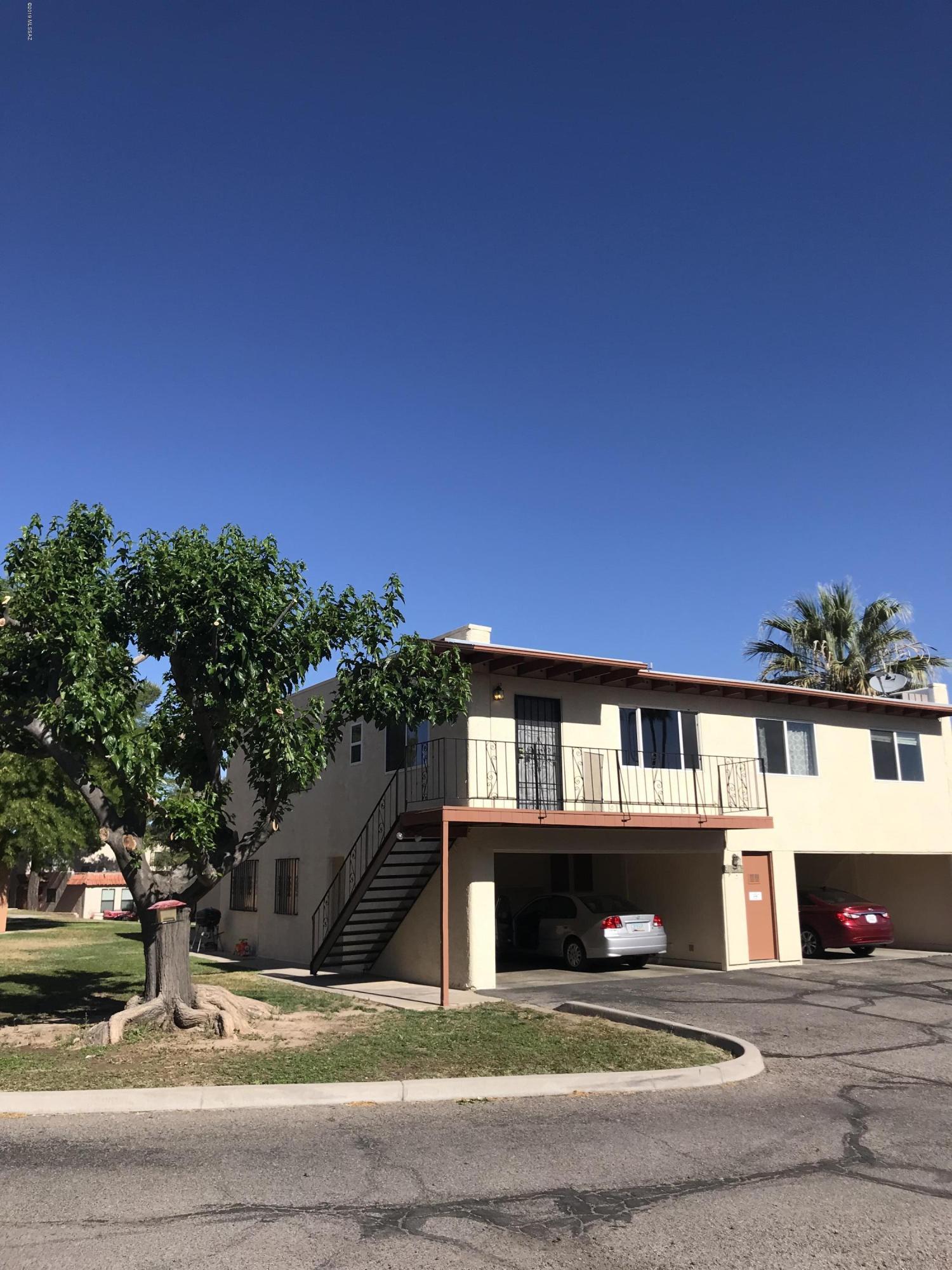 Sweet upstairs 2nd Floor Condo! Freshly painted and whistle clean ! Wood laminate flooring.  2Br 1BA has large open floor plan. Wood flooring in Great Room setting. Central AC.  Super location near Kolb & Tanque Verde. Carport with extra storage.  Laundry next to carport. Community Pool, Lush manicured grounds for evening strolls. Water AND Gas paid for by Landlord and is INCLUDED !