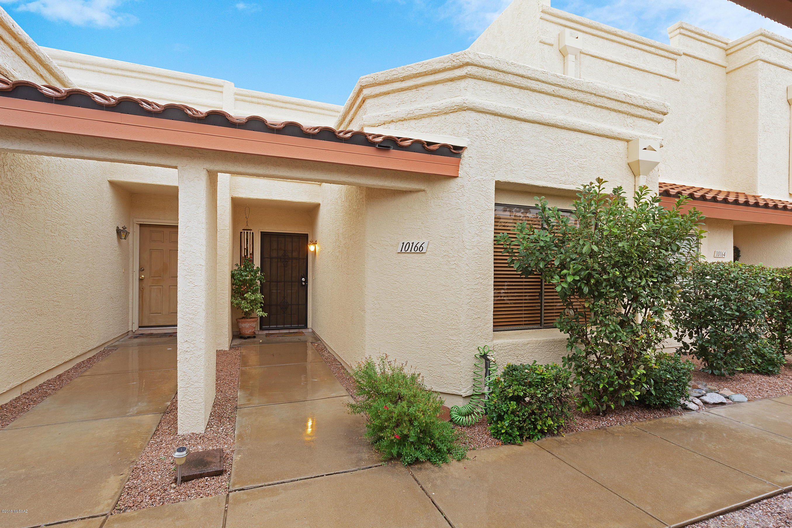 Charming 2 Bedroom/2 Bath Town home in the desirable Coronado Ridge subdivision.  This beautiful home features a split bedroom floor-plan with a large open kitchen, ample cabinetry and countertops, a spacious living room with plenty of sunlight and an atrium waiting for you to decorate and enjoy.  The covered patio has been enclosed with security screens for your privacy. Relish in the natural landscape as you relax on the patio.  HOA includes full use of the amazing heated pool, spa and clubhouse, roof maintenance, exterior paint, landscaping, liability insurance, exterior water, parking, and driveway maintenance.  Close to shopping and dining, stop by today.