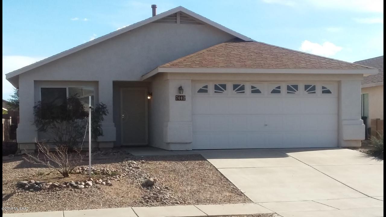 Nice open floor plan with vaulted ceilings. Nice kitchen with Stainless Steel Fridge and pull up bar that overlooks family room with fireplace. Nice covered patio with fruit trees. Exterior painted 1 year ago. This clean and bright home is ready for move in.